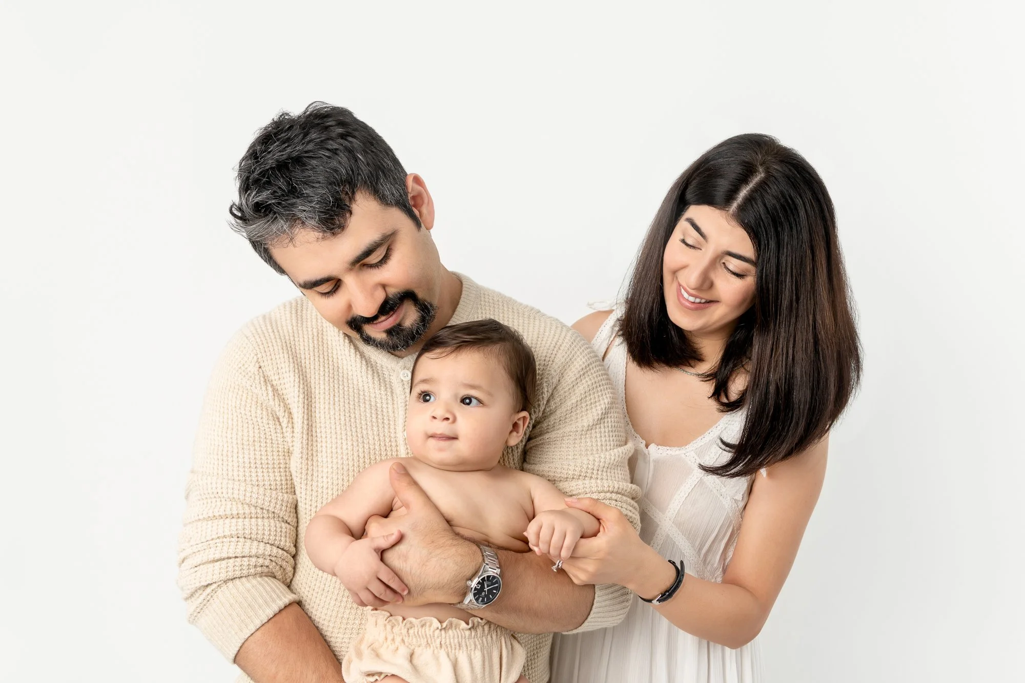  Nicole Hawkins Photography looks at their chunky baby boy with so much love during a studio portrait session in Northern New Jersey. family of three portrait NJ studio session family ideas young family outfit ideas #nicolehawkinsphotography #nicoleh