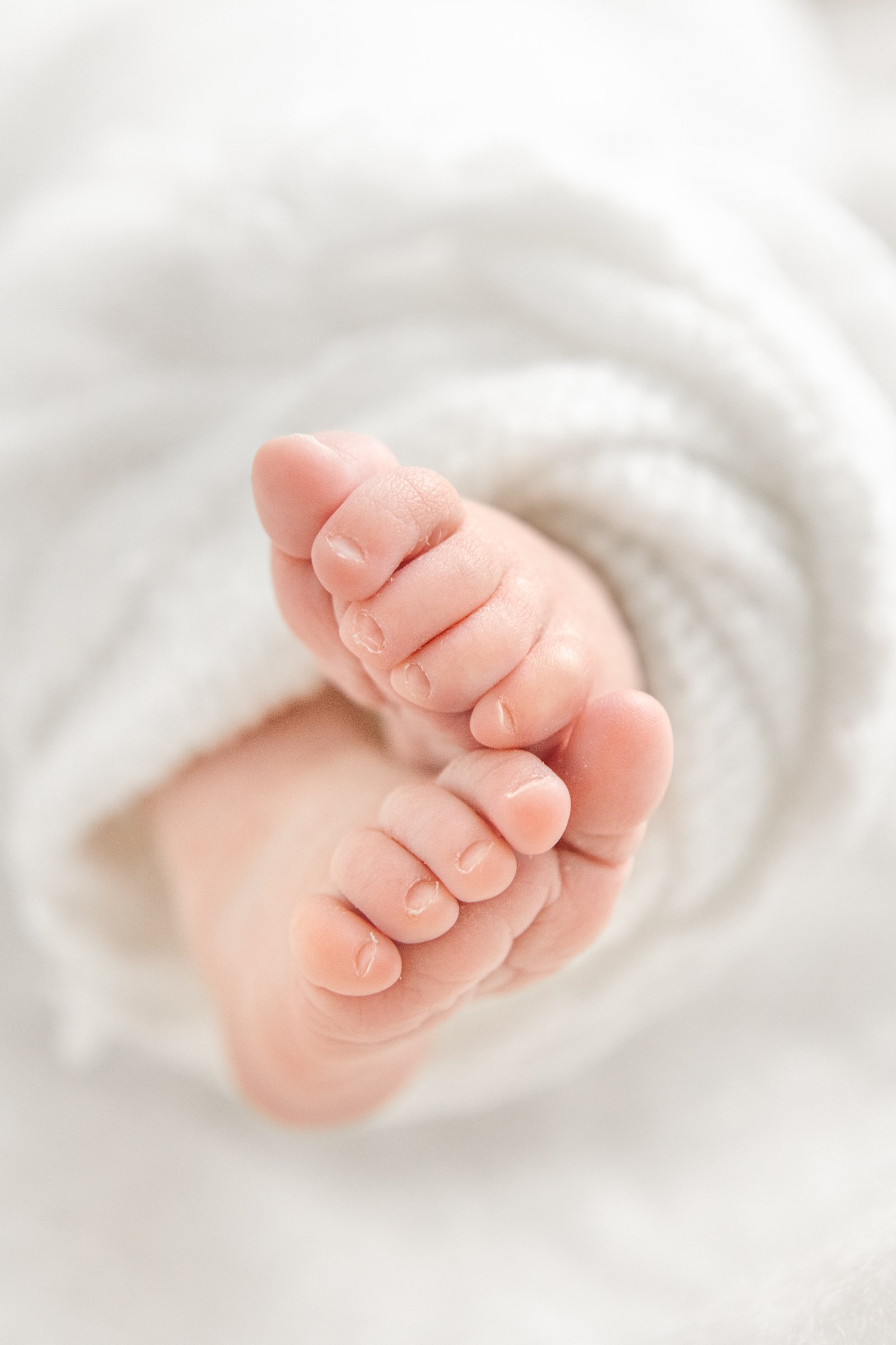  Baby feet close-up picture with sweet little toes by professional newborn photographer Nicole Hawkins Photography in Hoboken, New Jersey.  baby feet photo baby toes sweet baby feet detailed baby photos #nicolehawkinsphotography #nicolehawkinsnewborn
