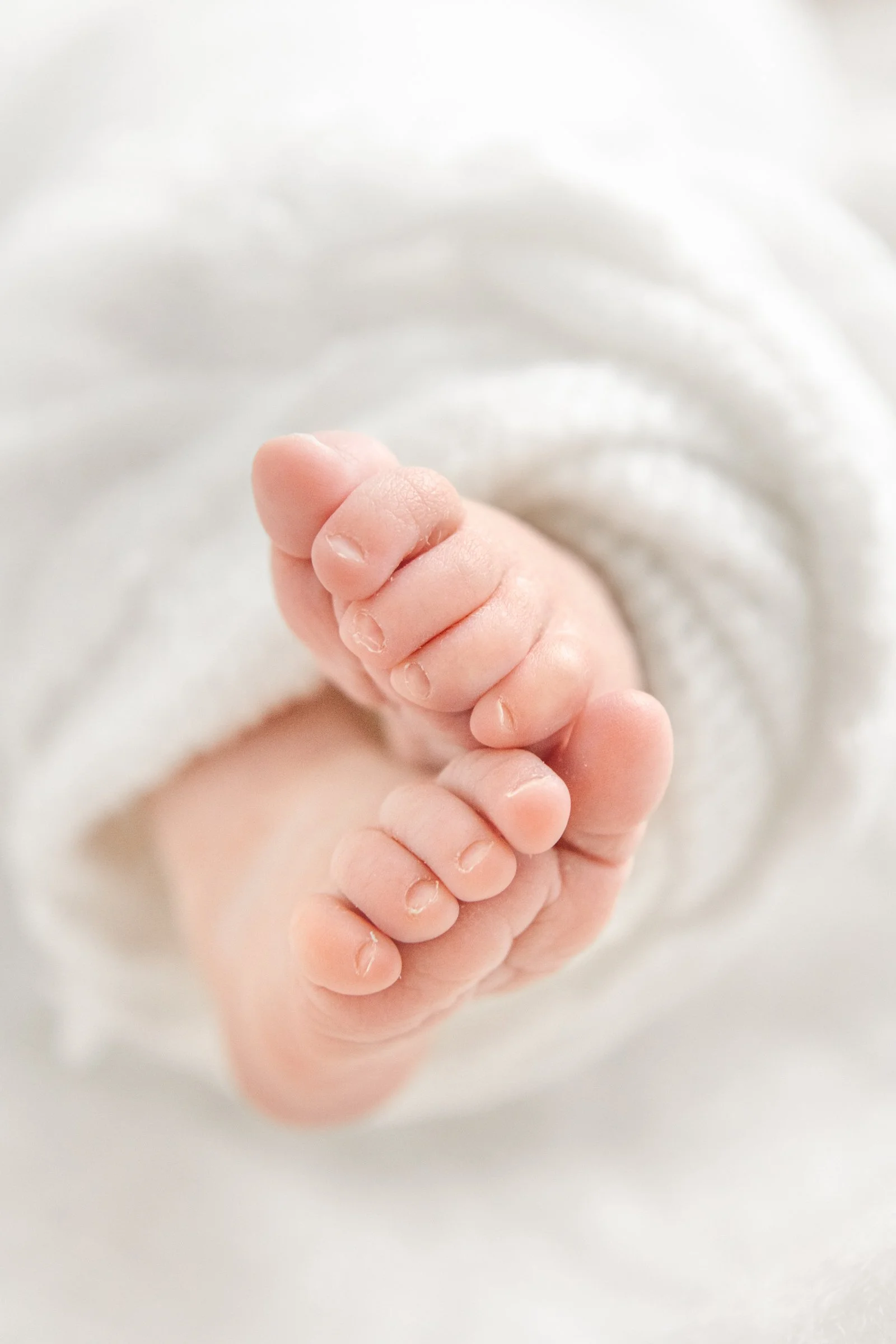  Baby feet close-up picture with sweet little toes by professional newborn photographer Nicole Hawkins Photography in Hoboken, New Jersey.  baby feet photo baby toes sweet baby feet detailed baby photos #nicolehawkinsphotography #nicolehawkinsnewborn