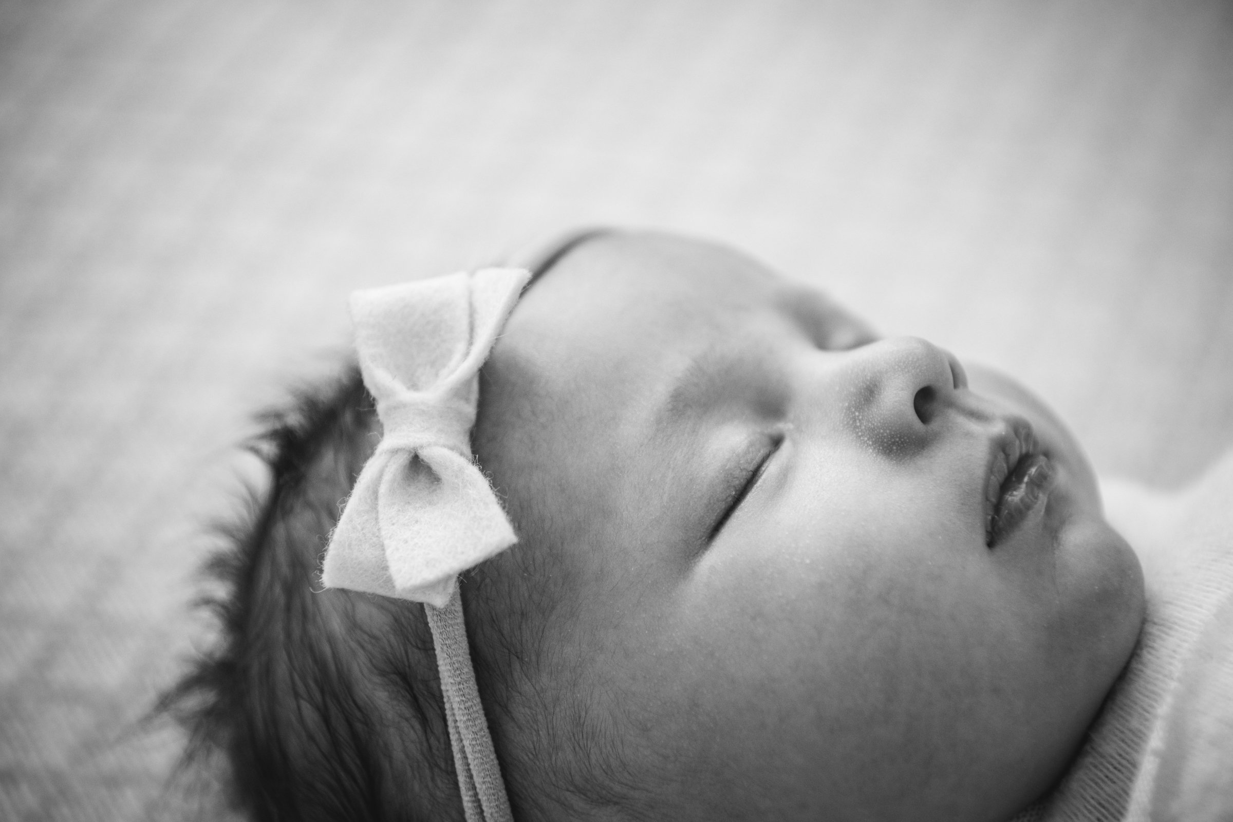  Sleeping baby with a little bow on her head, little baby lips, and button nose in a New Jersey home by Nicole Hawkins Photography. baby lips baby nose baby girl sleeping peacefully detailed baby photography #nicolehawkinsphotography #nicolehawkinsne