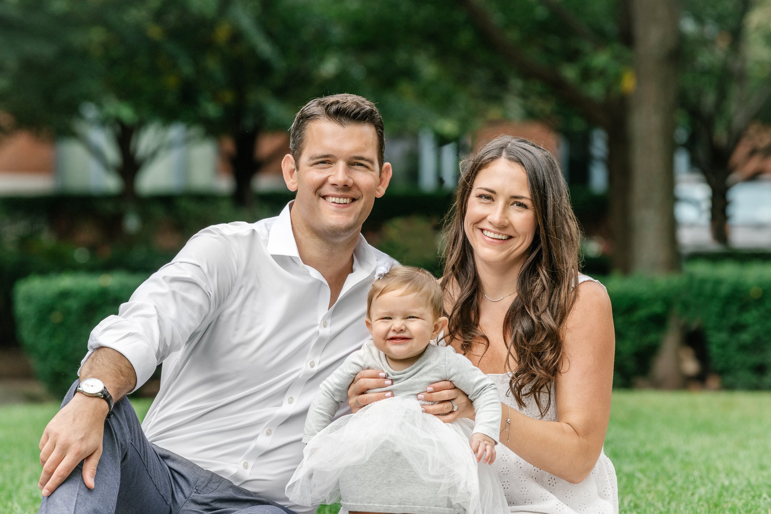 Family with a baby girl poses for a milestone portrait session with Nicole Hawkins Photography in NJ. baby with parents milestone portrait session #nicolehawkinsphotography #newjerseyphotographer #familyphotographer #6monthportrait #NJfamilyphoto 