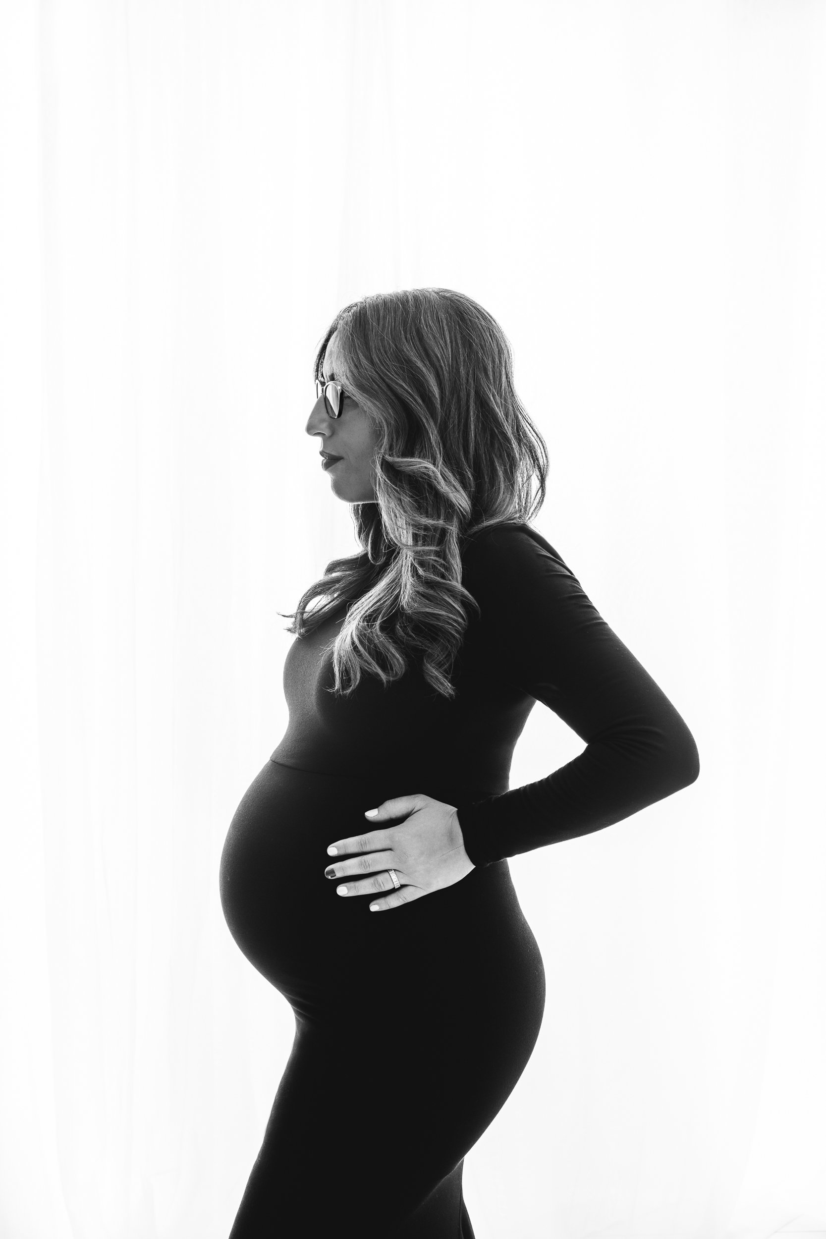  NJ maternity photographer Nicole Hawkins Photography captures a black and white silhouette of a mother-to-be. mother to be maternity shot #NicoleHawkinsPhotography #maternitysession #NJmaternityphotographer #NewJerseyphotographers #maternityphotos 