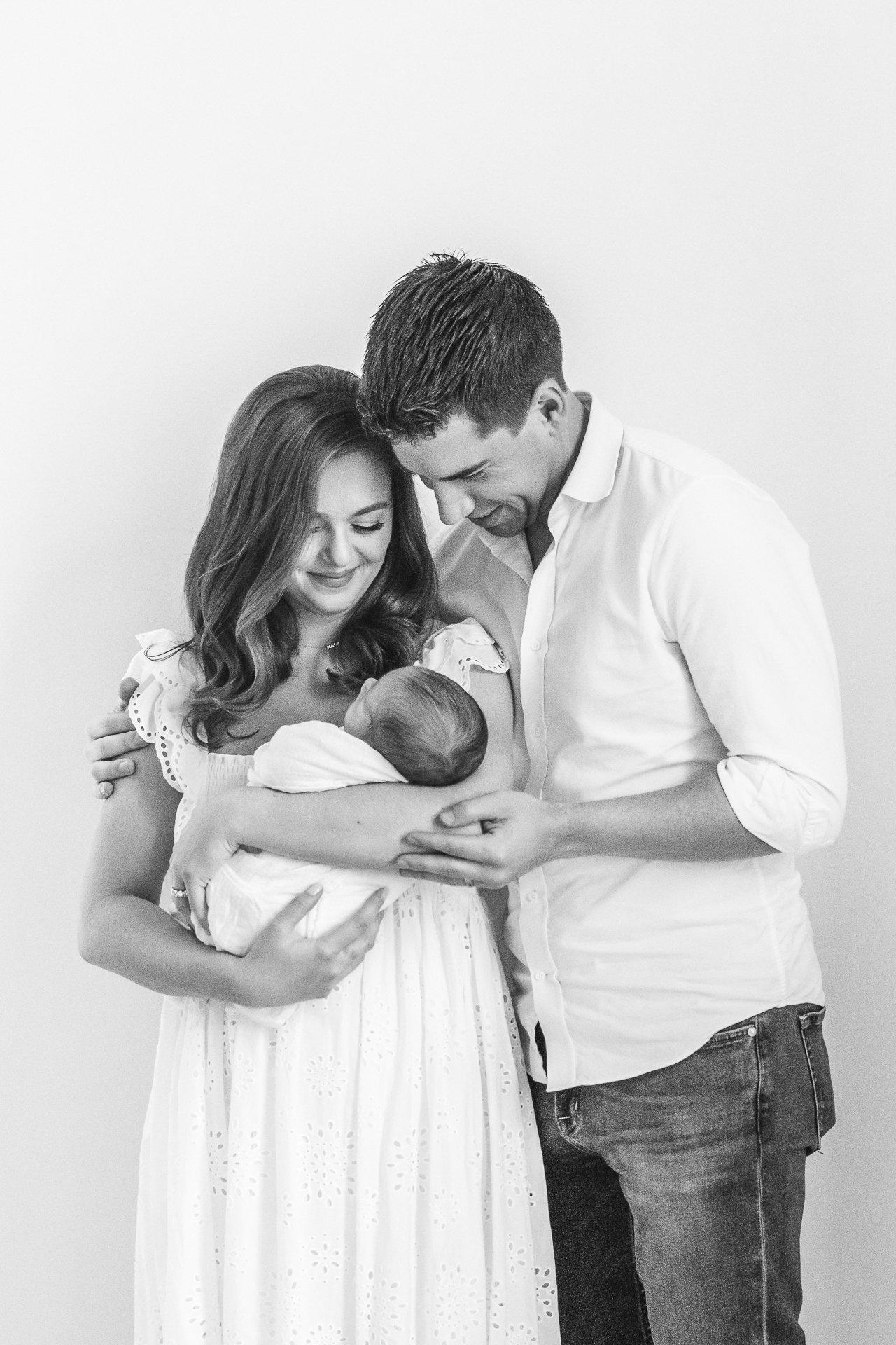  A stunning portrait of a new family with a baby boy in a studio in New York by Nicole Hawkins Photography. new family family of three NYC newborn #nicolehawkinsphotography #NYCbabyphotography #newbornportraits #NewYorkStudioPhotography #newbornsessi