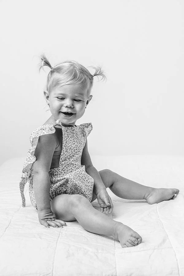  Northern New Jersey photographer Nicole Hawkins Photography captures a black and white baby portrait. baby on bed baby portrait goals #nicolehawkinsphotography #NJstudioportraits #babyportraits #babygirlportraits #NJbabyphotographers #NJphotographer