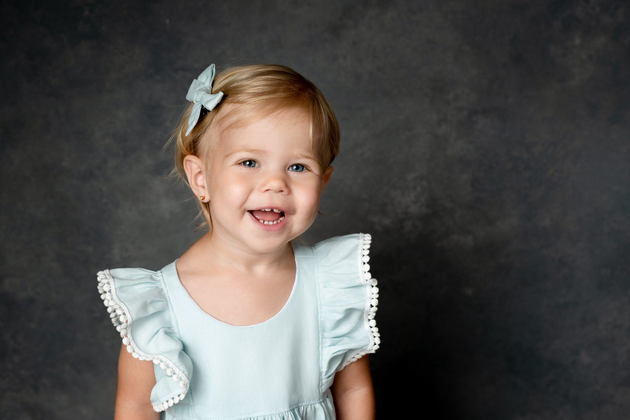  Nicole Hawkins Photography captures a darling toddler girl in a baby blue dress. baby blue toddler dress toddler portrait ideas #nicolehawkinsphotography #NJstudioportraits #babyportraits #babygirlportraits #NJbabyphotographers #NJphotographers 