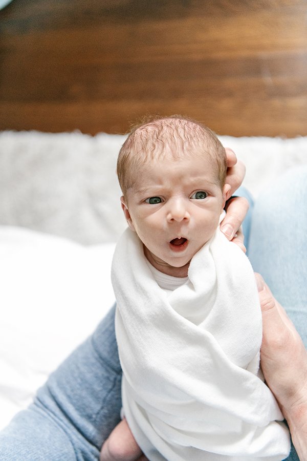  A baby swaddled in white yawns was captured by Nicole Hawkins Photography. New Jersey photographer yawning baby white swaddle #nicolehawkinsphotography #NJfamilyphotographer #inhomenewbornsession #nicolehawkinsnewborns #NJnewbornphotography 