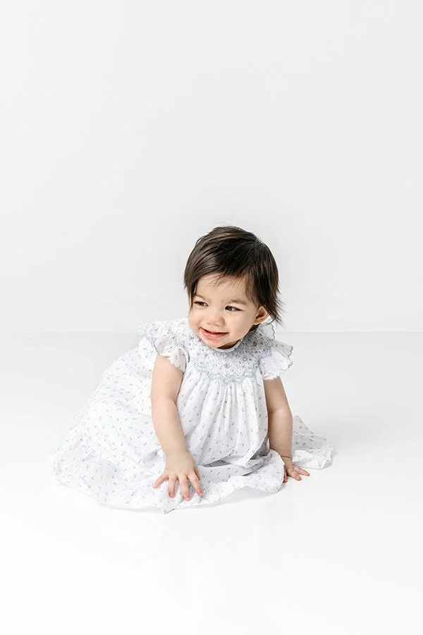  First birthday portraits of a crawling little girl by Nicole Hawkins Photography in New Jersey. New Jersey studio birthday baby girl #nicolehawkinsphotography #nicolehawkinsbirthday #nicolehawkinsportraits #NJstudiophotography #1stbirthday 