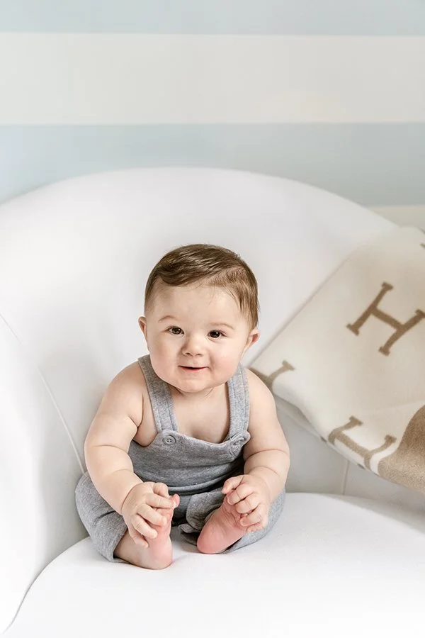  Baby sitter session with little one touching his toes captured by Nicole Hawkins Photography. brown hair toes #NicoleHawkinsPhotography #NicoleHawkinsMilestones #BabyMilestoneSession #NJfamilyphotographer #Inhomephotography #babyportraits 