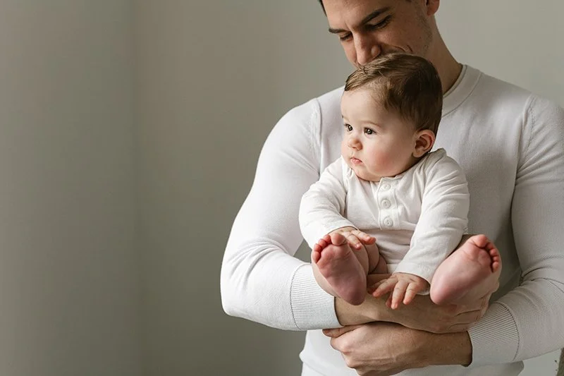  New Jersey family photographer Nicole Hawkins Photography captures a daddy holding his little boy. daddy and baby #NicoleHawkinsPhotography #NicoleHawkinsMilestones #BabyMilestoneSession #NJfamilyphotographer #Inhomephotography #babyportraits 
