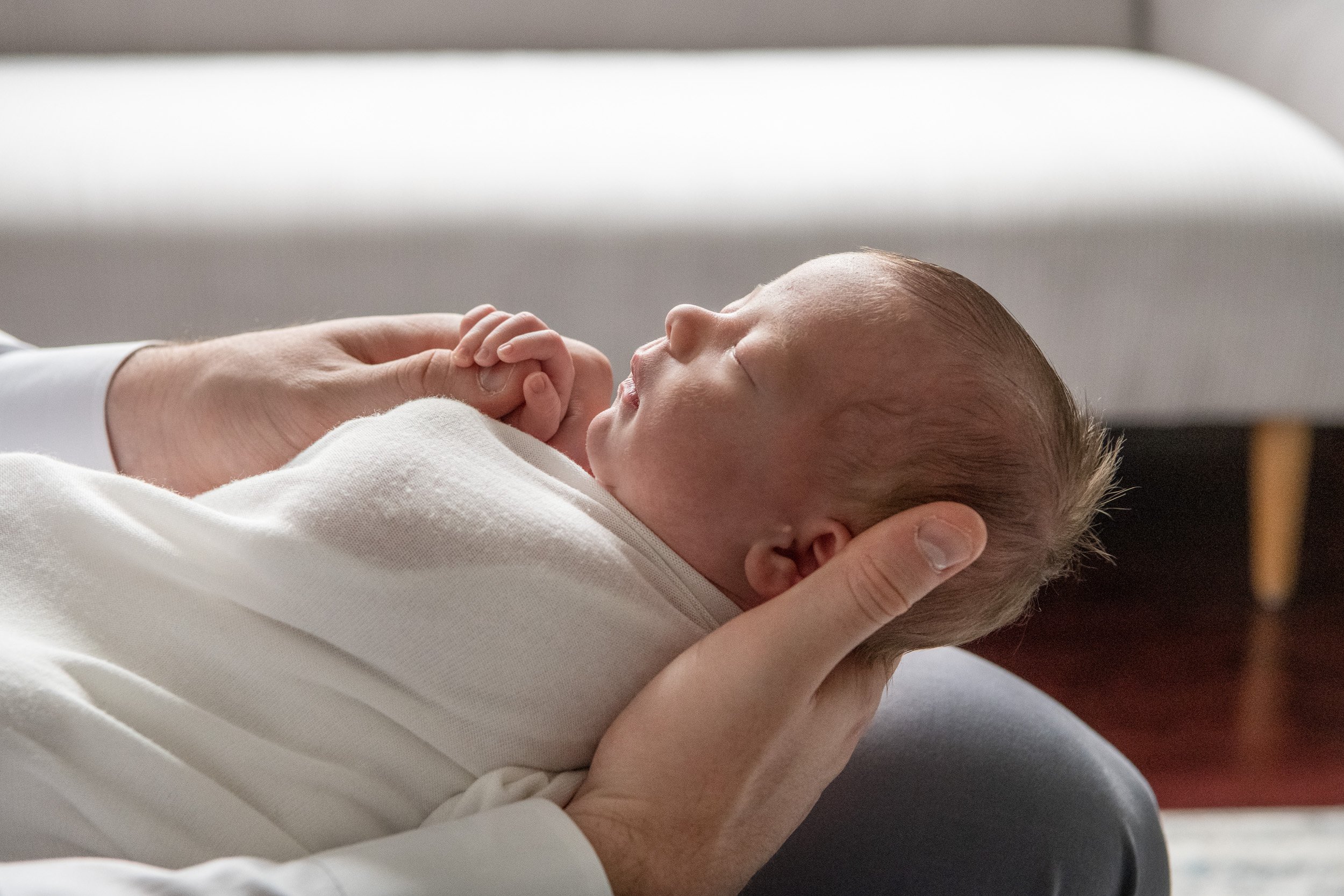  Nicole Hawkins Photography captured the detail of a newborn baby holding onto a father's finger. New Jersey family photographer #NewbornSession #NJfamilyphotographer #Inhomebabyphotography #newborn #NicoleHawkinsPhotography #NicoleHawkinsNewborns 