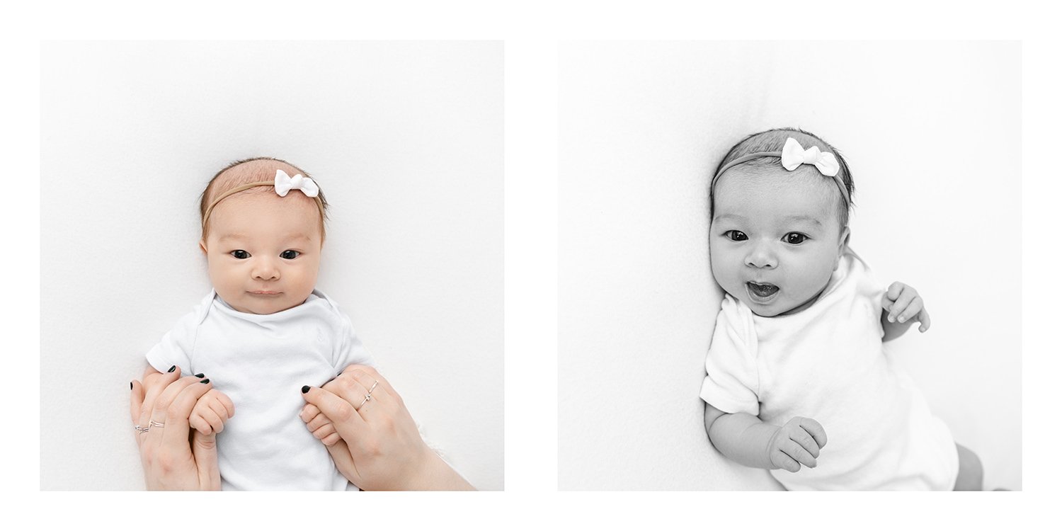  Newborn girl in white onesie and white bow is held by her mother during a newborn studio portrait session with Nicole Hawkins #studioportraits #newborn #maplewoodNJ #nicolehawkinsphotography #newjerseyphotographer  #portraitphotography #heirloomphot