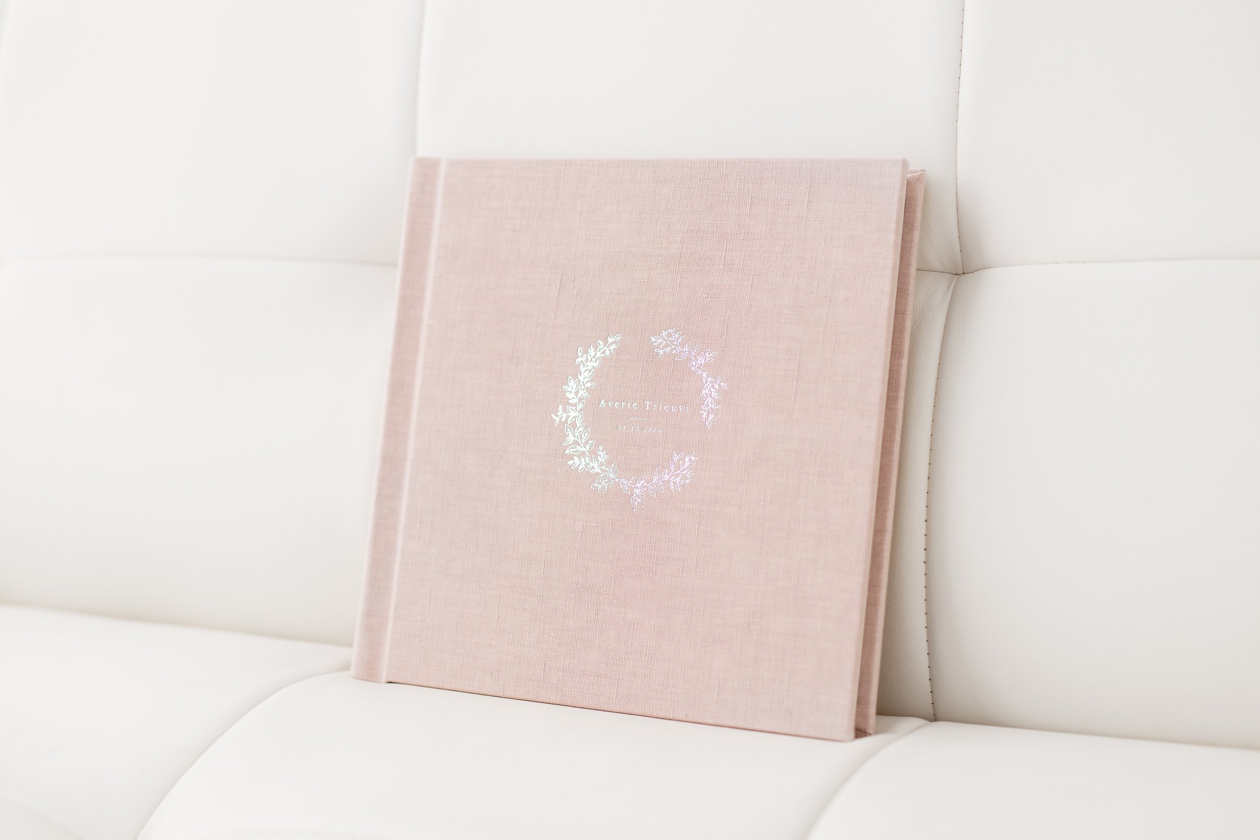  A pink linen bound studio portrait book created by Nicole Hawkins Photography, a New Jersey and New York studio photographer #studioportraits #newborn #maplewoodNJ #nicolehawkinsphotography #newjerseyphotographer  #portraitphotography #heirloomphoto