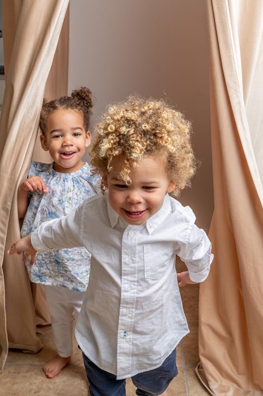  Toddler twins play in a photography studio while taking portraits by Nicole Hawkins Photography. NJ twin photography toddler photographer #NicoleHawkinsPhotography #NicoleHawkinsBabies #StudioPhotography #NewJerseyPhotographer #twinphotography   