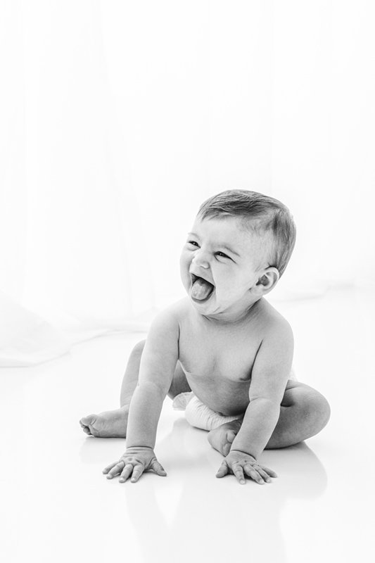  Naked laughing smiling baby girl sitting up by Nicole Hawkins Photography. tongue out baby girl smiling baby photographer NJ #sixmonthbabyportraits #NJPhotographer #NicoleHawkinsPhotography #NicoleHawkinsBabies #BabyStudioPhotography    