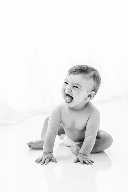  Naked laughing smiling baby girl sitting up by Nicole Hawkins Photography. tongue out baby girl smiling baby photographer NJ #sixmonthbabyportraits #NJPhotographer #NicoleHawkinsPhotography #NicoleHawkinsBabies #BabyStudioPhotography    