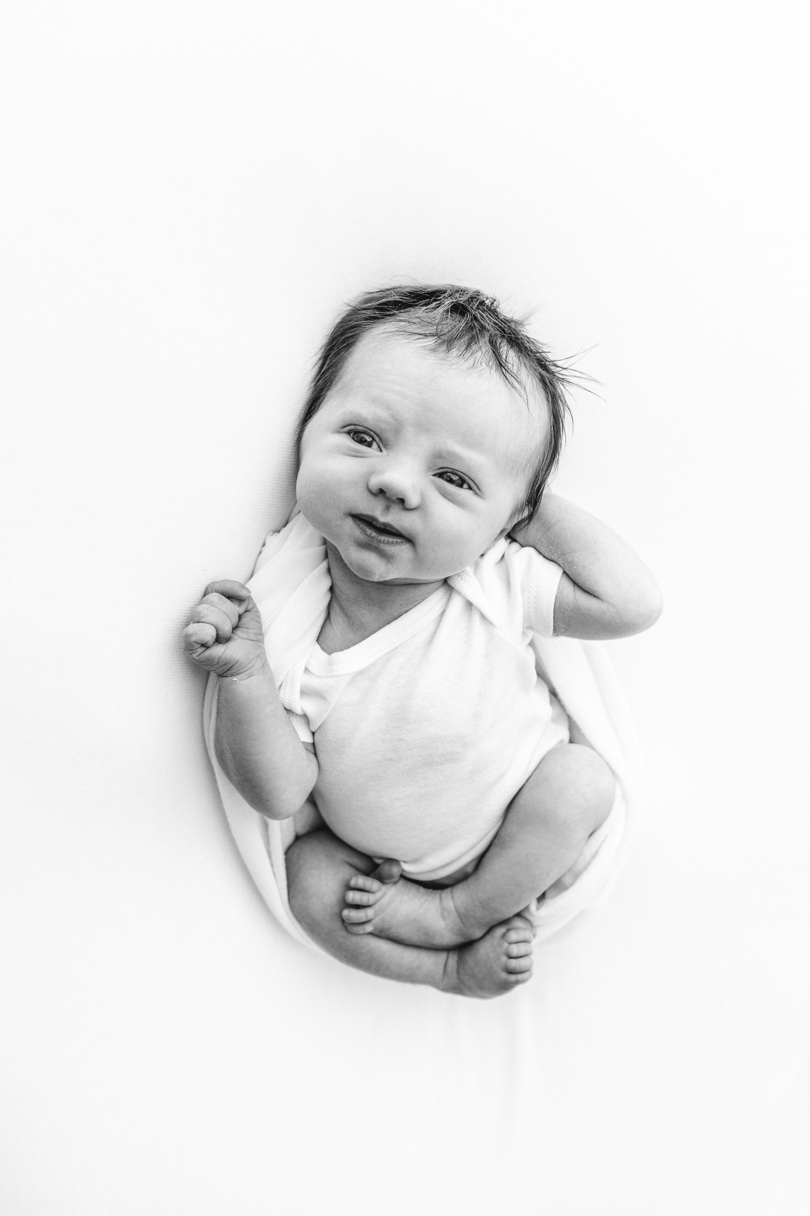  Newborn studio session with black and white portraits of a baby girl by Nicole Hawkins Photography. newborn baby girl #NicoleHawkinsPhotography #NicoleHawkinsNewborns #StudioPhotography #NewYorkPhotographer #NJphotographers #newborn 
