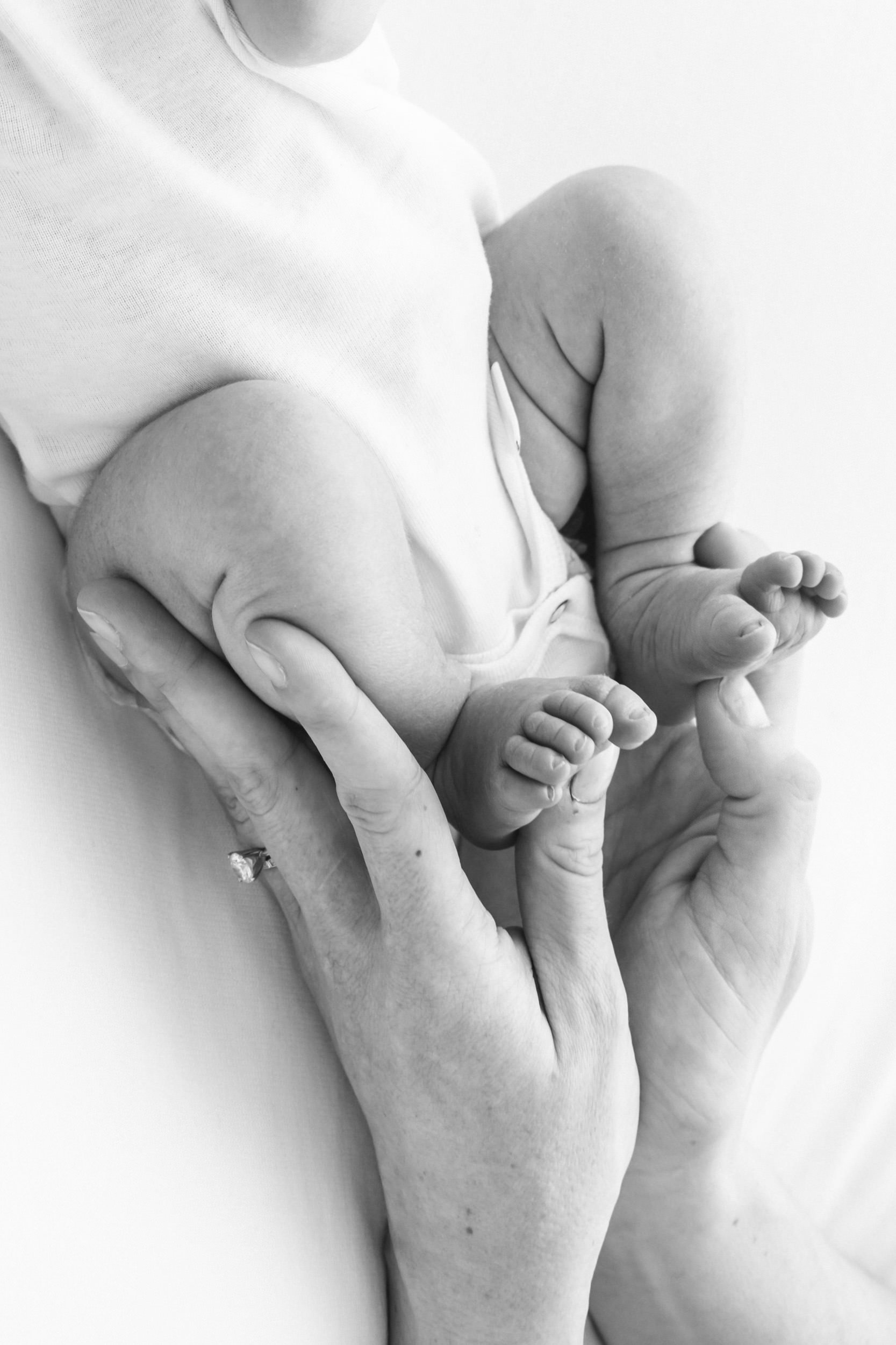  Black and white portrait of newborn baby feet at a studio in New Jersey by Nicole Hawkins Photography. baby feet newborn details #NicoleHawkinsPhotography #NicoleHawkinsNewborns #StudioPhotography #NewYorkPhotographer #NJphotographers #newborn 