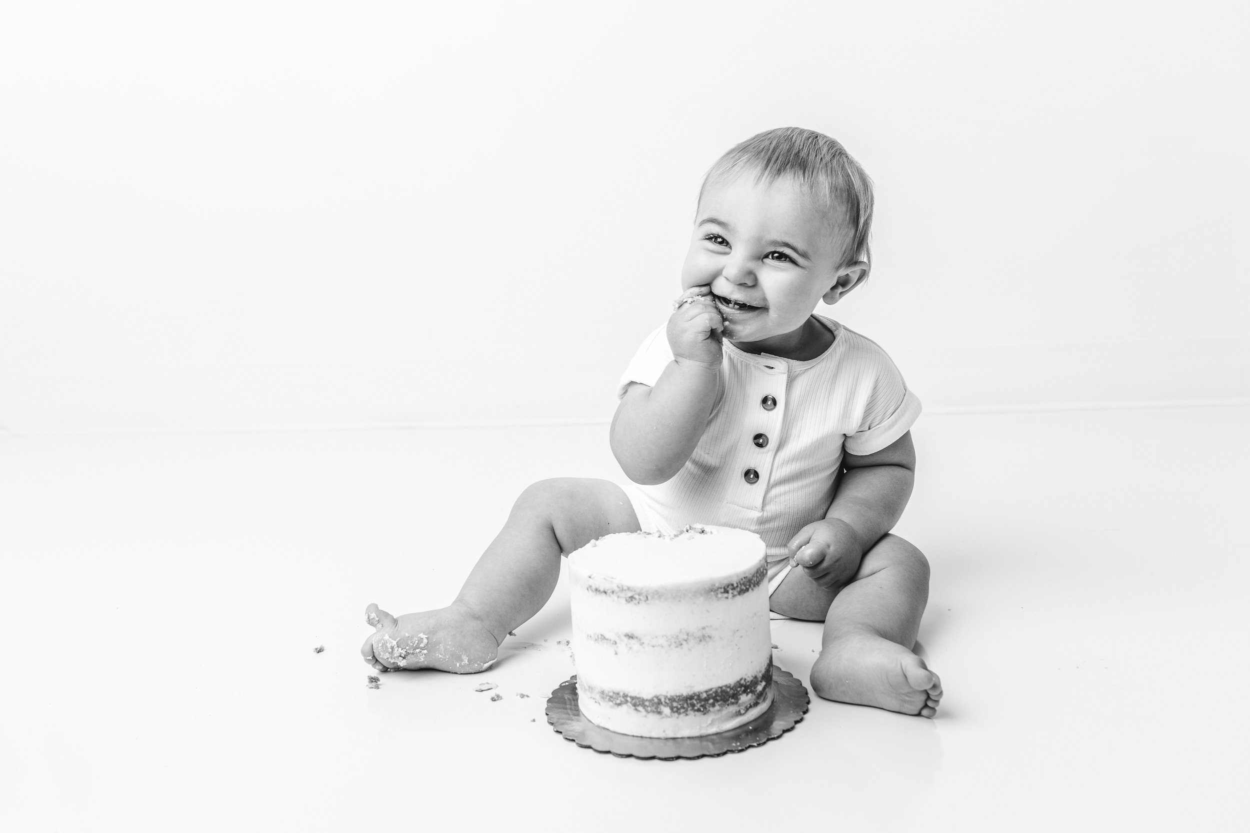  First birthday session with a little boy eating his cake by Nicole Hawkins Photography in NJ. NY NJ child photographers #NicoleHawkinsPhotography #NicoleHawkinsBabies #BirthdayStudioPhotography #smashcake #firstbirthday #studiobabiesandchildren 