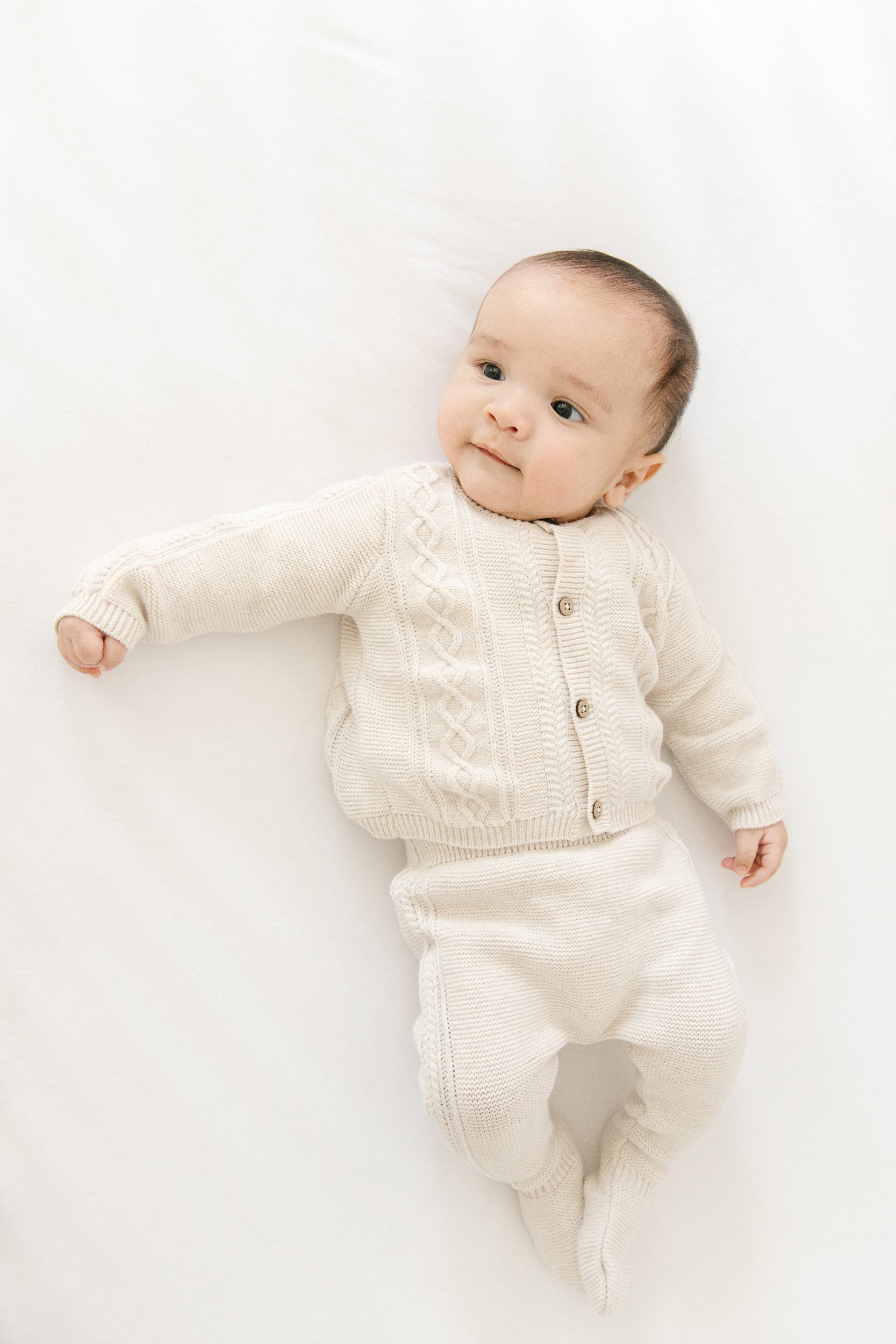  Family Photographer Nicole Hawkins Photography captures a neutral portrait of a newborn in his home. home newborns #NicoleHawkinsPhotography #InHomeNewborns #NurseryNewborns #NYCbabyphotography #babyportraits #ZooNursery #familyportraits 