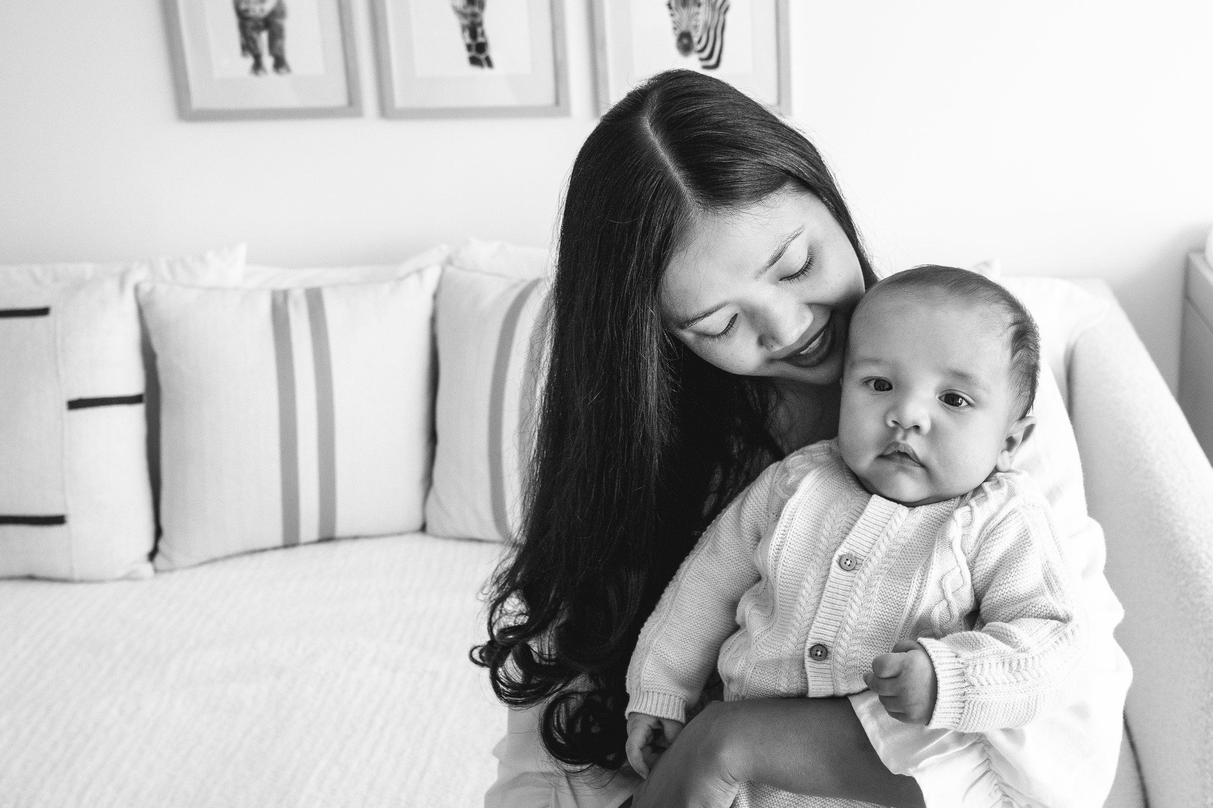  Black and white portrait of a mother holding her baby boy by Nicole Hawkins Photography. NY family photography #NicoleHawkinsPhotography #InHomeNewborns #NurseryNewborns #NYCbabyphotography #babyportraits #ZooNursery #familyportraits 