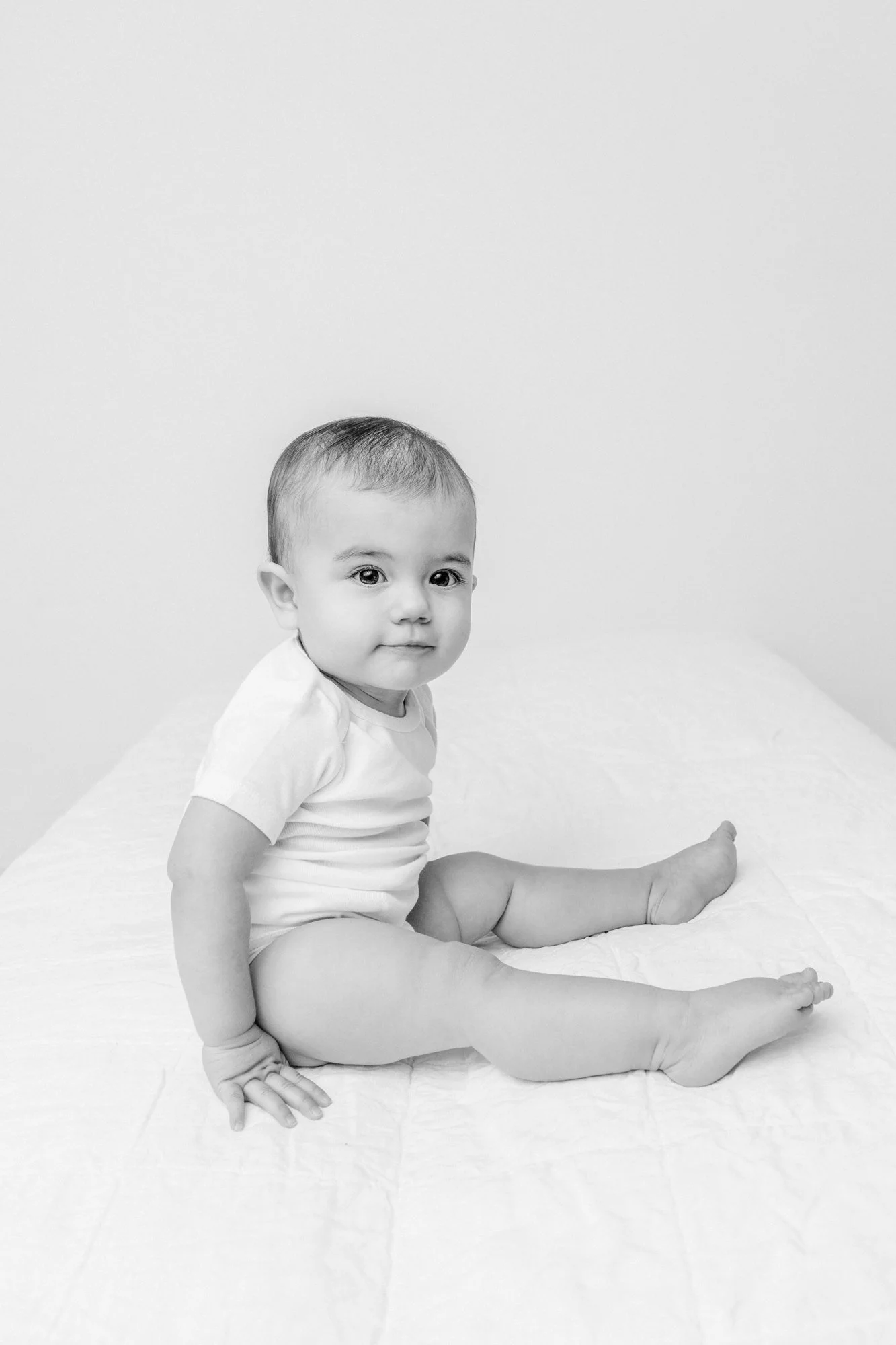  A black and white portrait of a baby girl captured by Nicole Hawkins Photography. NJ baby portrait photographer #NicoleHawkinsPhotography #firstbirthday #babyportraits #NJphotographers #lifestylephotography #studiobabies #childrenphotography 