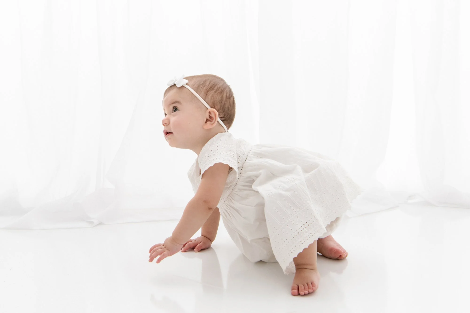 Nicole Hawkins Photography captures a little girl on the move during first birthday portraits. classic portraits #NicoleHawkinsPhotography #firstbirthday #babyportraits #NJphotographers #lifestylephotography #studiobabies #childrenphotography 