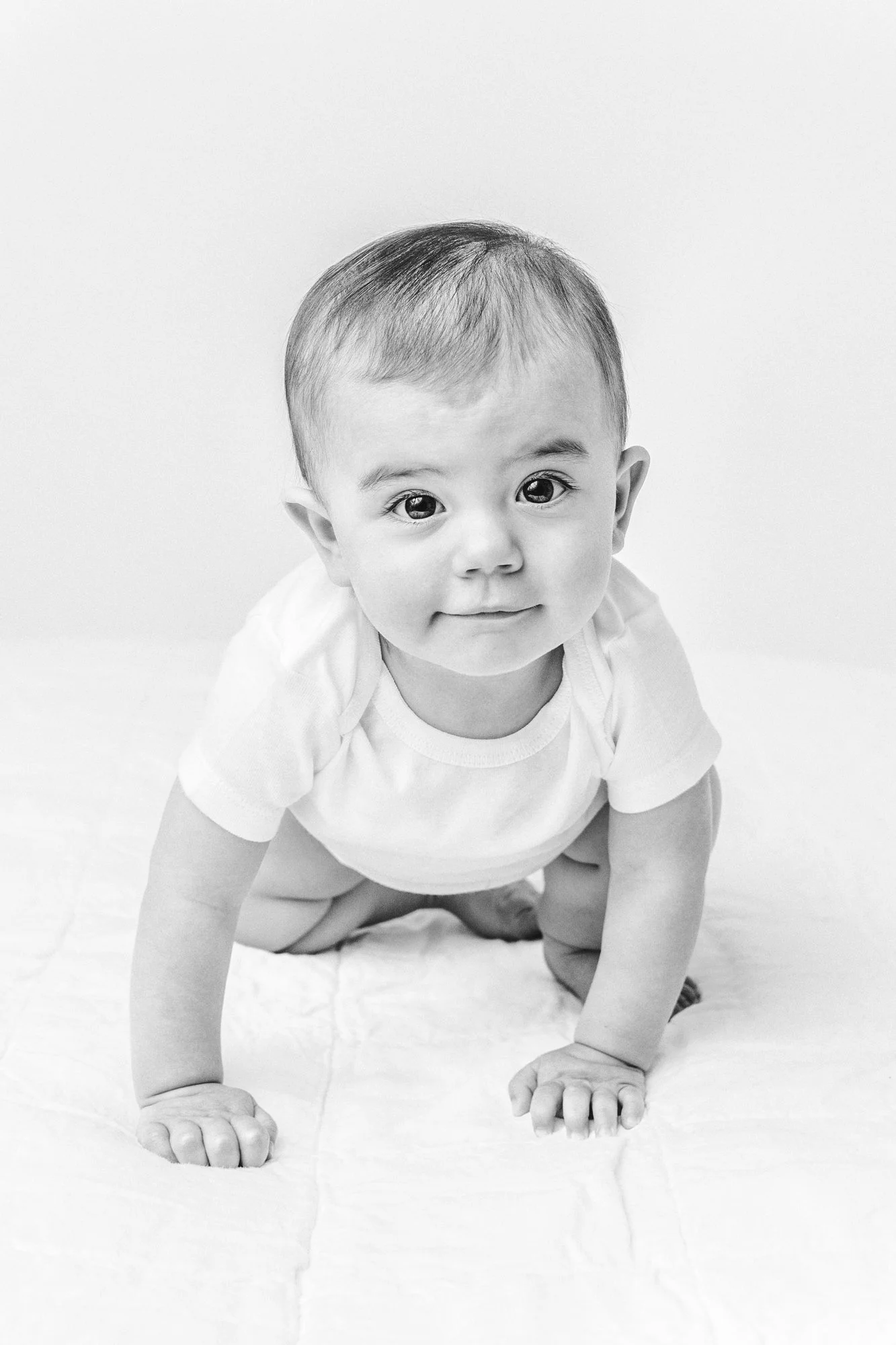  Close-up portrait in black and white of a girl for her first birthday by Nicole Hawkins Photography. NJ Studio #NicoleHawkinsPhotography #firstbirthday #babyportraits #NJphotographers #lifestylephotography #studiobabies #childrenphotography 