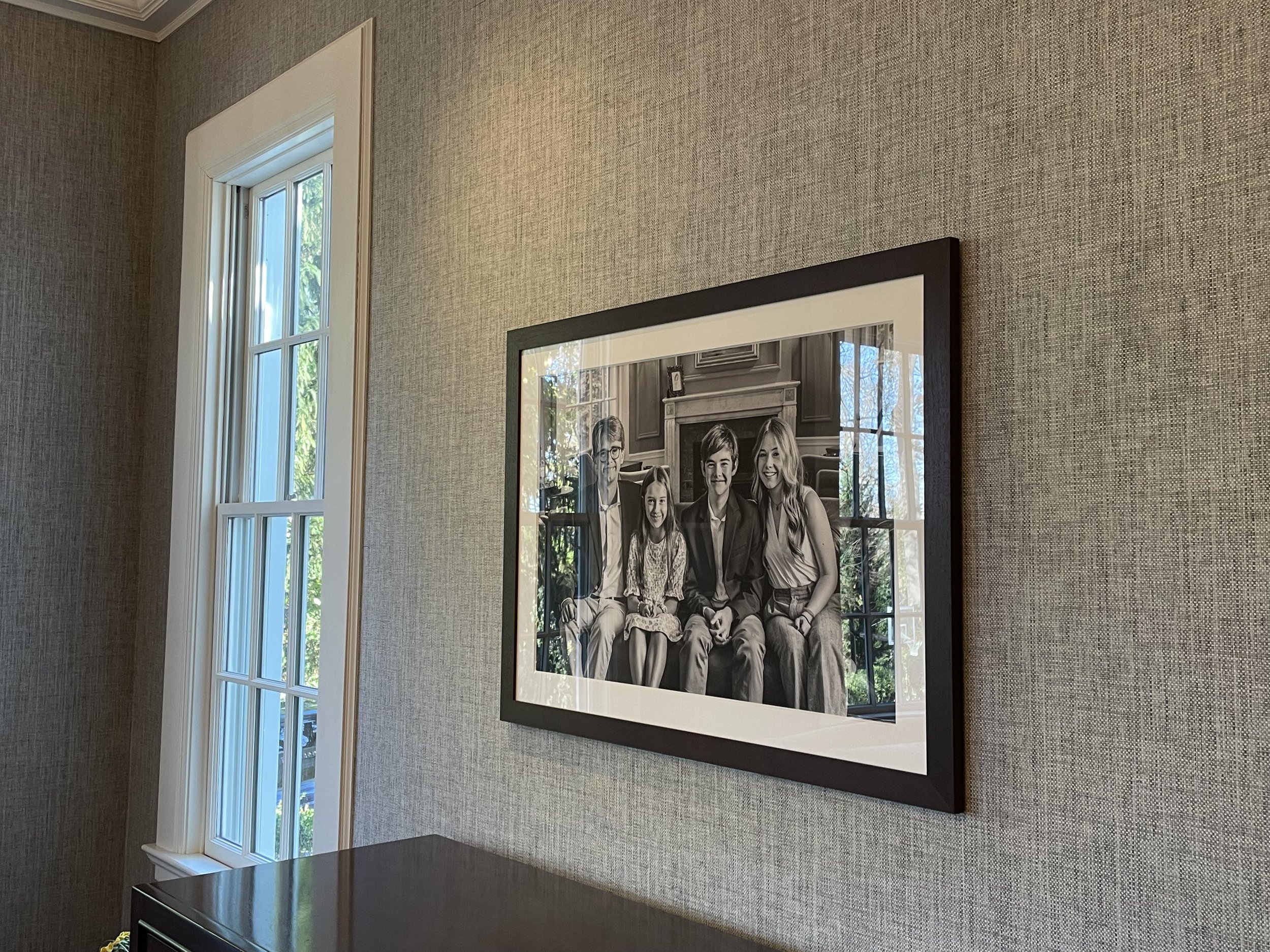  A Nicole Hawkins Photography family portrait in a black frame displayed on a wall in a New Jersey home. family portraits displayed #NicoleHawkinsPhotography #NicoleHawkinsFamilyPortrait #NicoleHawkinsSenior #NJPortraits #siblingportrait 