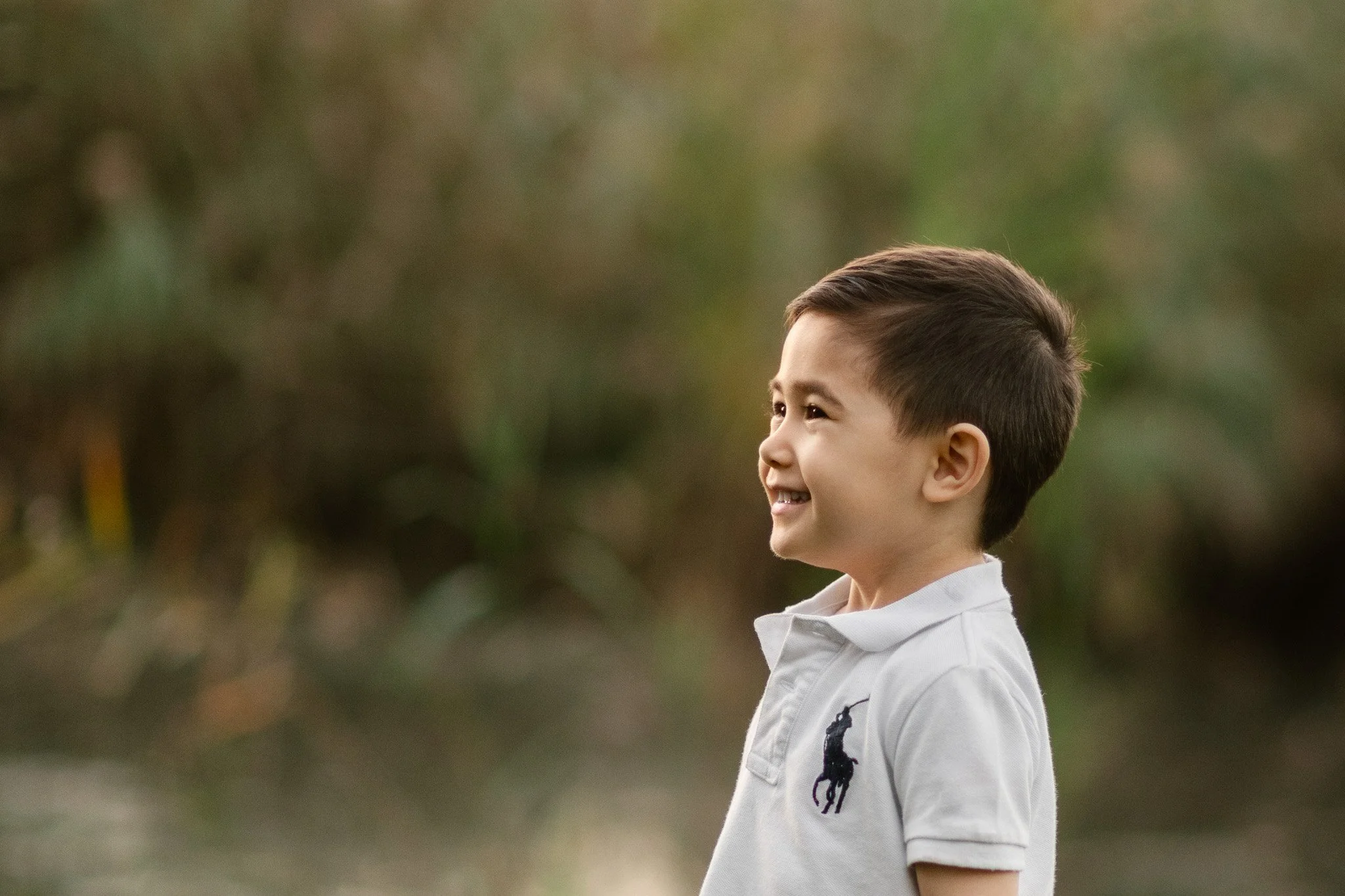  New Jersey family photographer Nicole Hawkins Photography captures a profile picture of a young boy. white polo profile #NicoleHawkinsPhotography #NicoleHawkinsFamilies #fallfamilyphoto #NorthernNewJerseyPhotography #outdoorfamilyportraits 