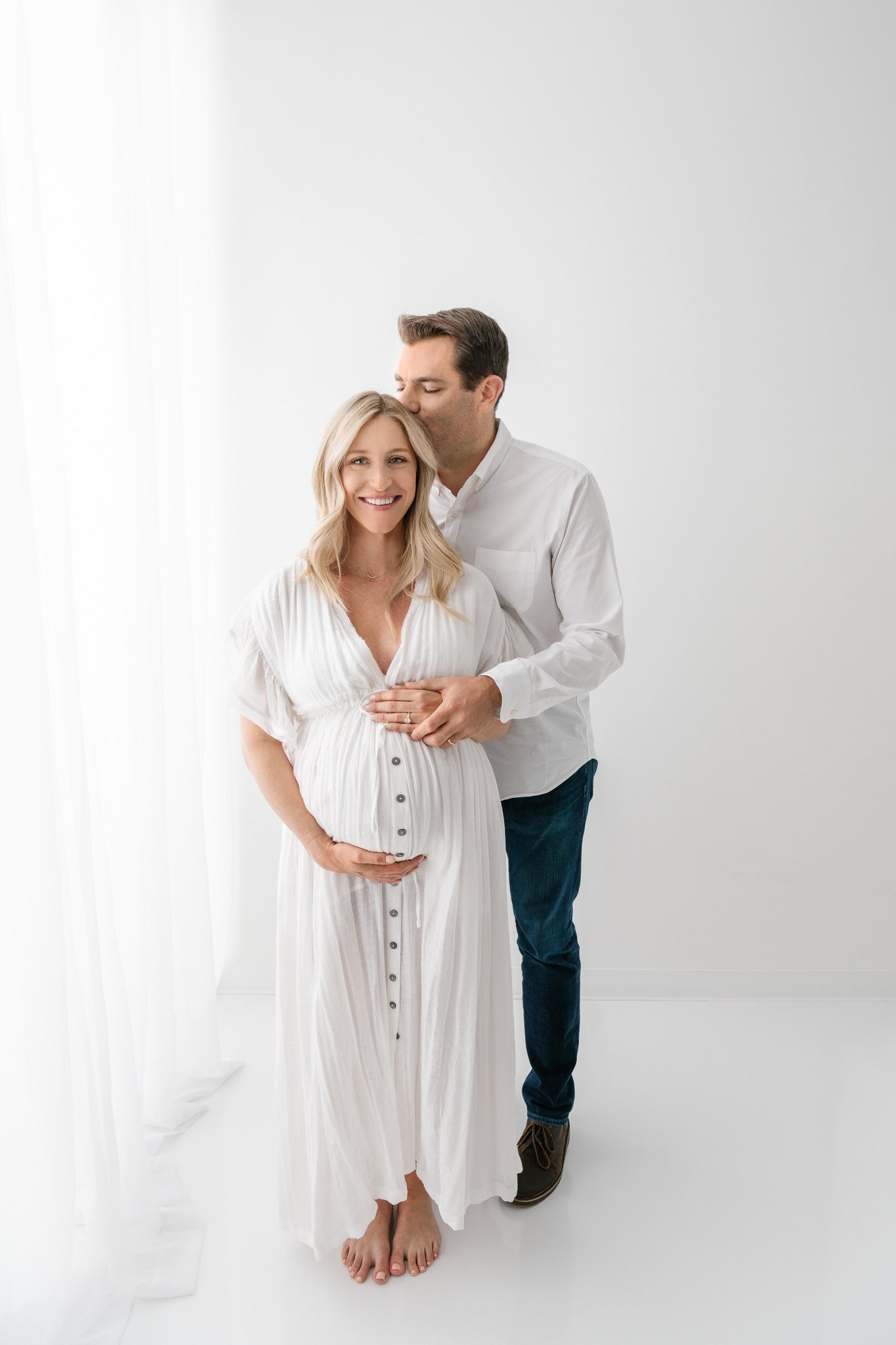 Portrait of soon-to-be parents with the husband kissing his wife's head by Nicole Hawkins Photography. before the baby pics #NicoleHawkinsPhotography #NicoleHawkinsMaternity #Studiomaternityportraits #NewJerseymaternity #NewYorkMaternity 