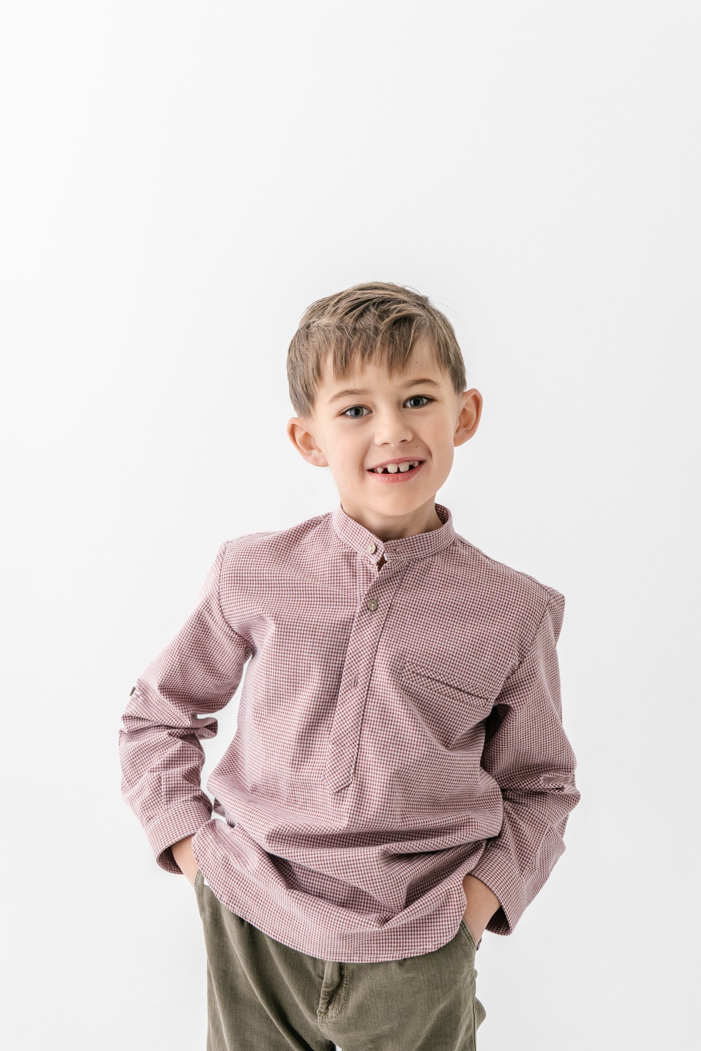  Studio portrait of a big brother in his button-down shirt by Nicole Hawkins Photography. studio portraits family portraits #NicoleHawkinsPhotography #NicoleHawkinsFamily #Newborns #MaplewoodNJ #studiofamilyportraits #modernfamilyportraits 