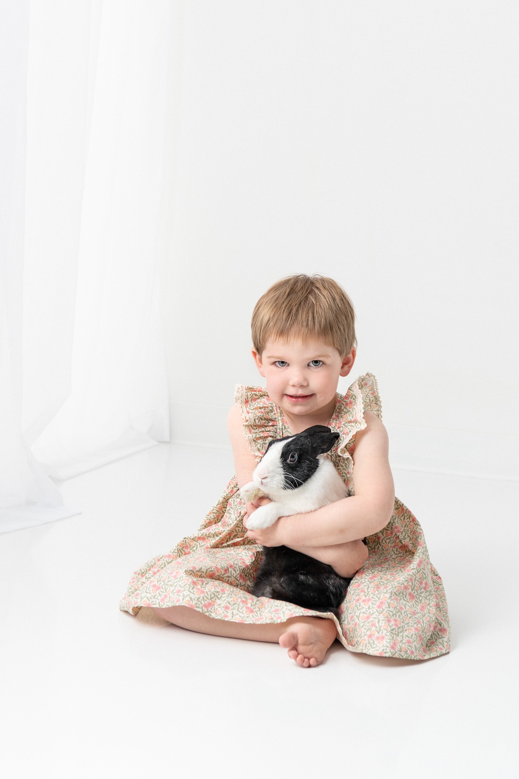  Little girl hugging her pet bunny in a studio portrait by Nicole Hawkin Photography. kid hugging bunny cookie bunny #NicoleHawkinsPhotography #NicoleHawkinsChildren #3rdbirthday #studioportrait #agirlandherbunny #littlegirl  