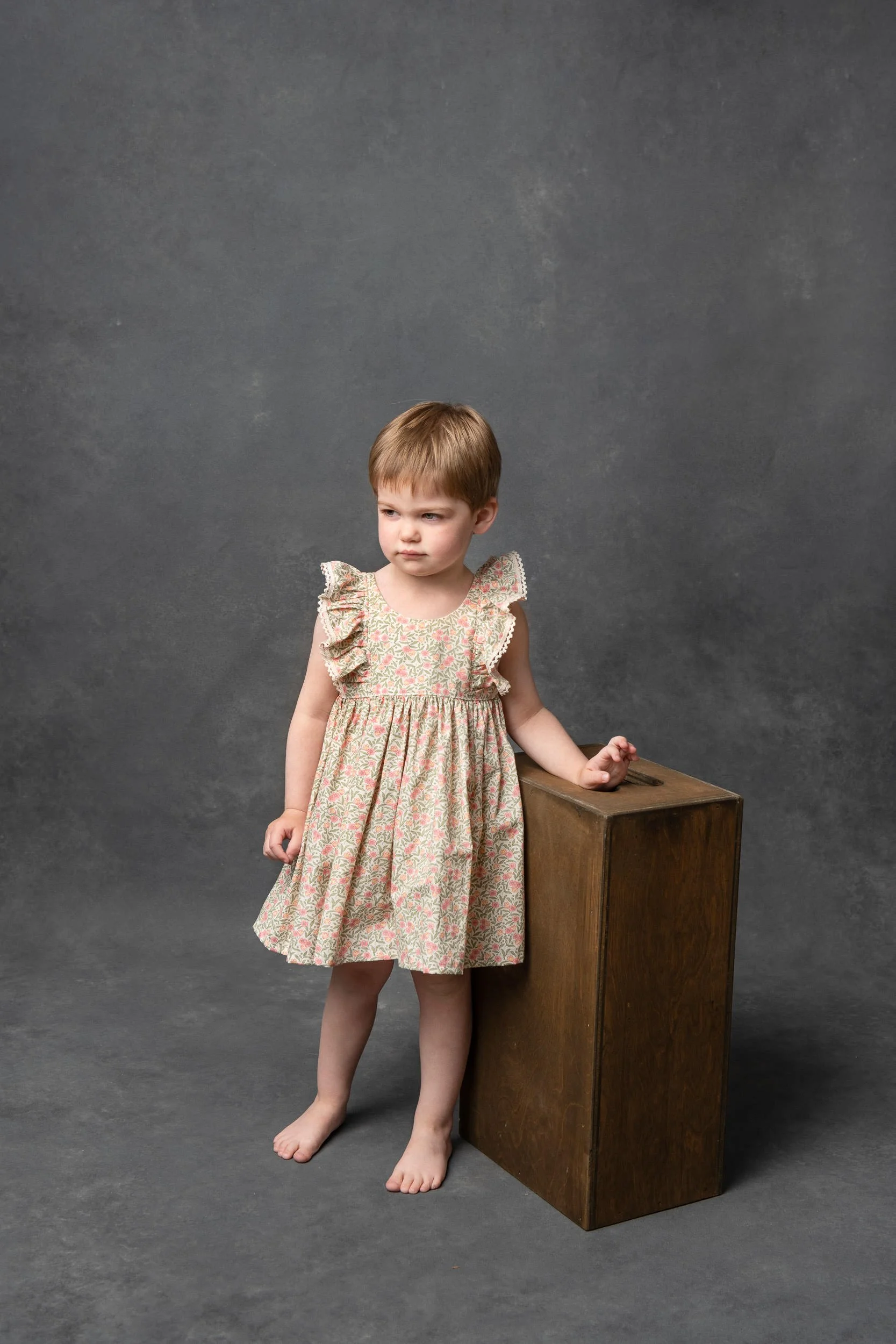  Little girl wearing a floral dress for her birthday photography session with Nicole Hawkins Photography. retro style studio pics #NicoleHawkinsPhotography #NicoleHawkinsChildren #3rdbirthday #studioportrait #agirlandherbunny #littlegirl  