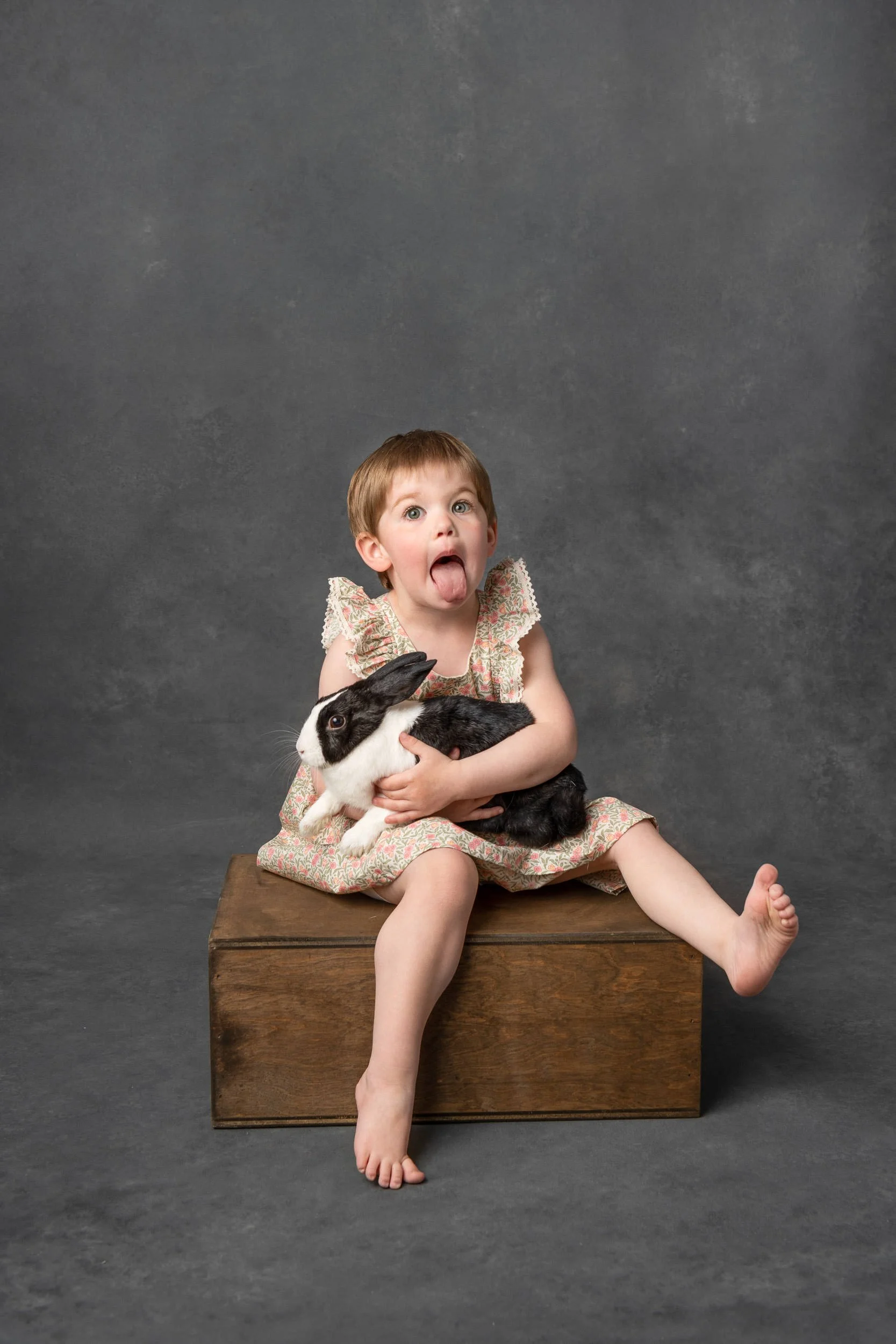 Black and white studio portrait of a little girl for a milestone birthday session with Nicole Hawkins Photography. kid poses with toes #NicoleHawkinsPhotography #NicoleHawkinsChildren #3rdbirthday #studioportrait #agirlandherbunny #littlegirl&nbsp; 