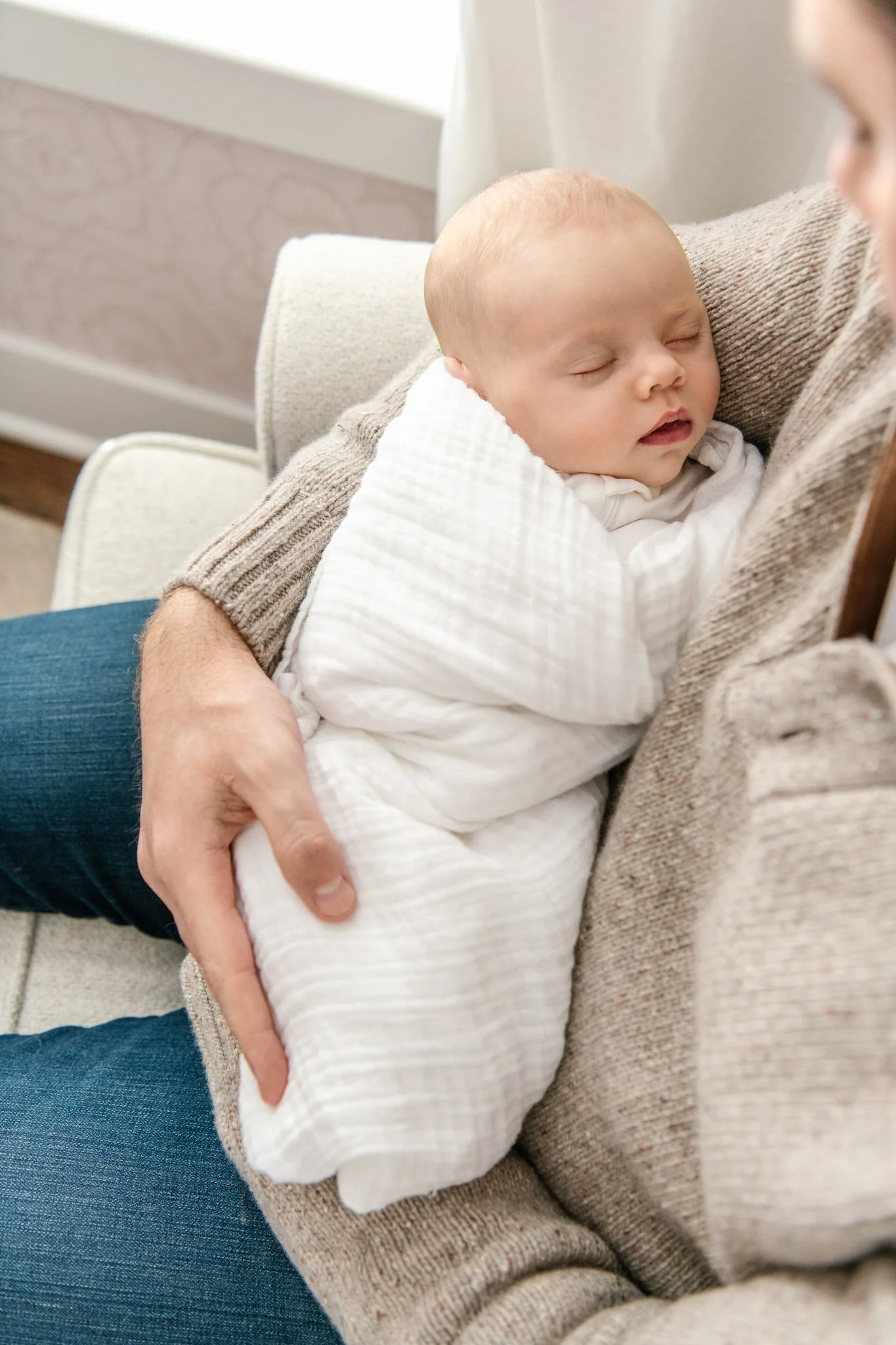  Baby girl in her father's arms sleeping by NJ newborn photographer Nicole Hawkins Photography. in home newborns with dad #NicoleHawkinsPhotography #NicoleHawkinsNewborns #InHomeNewborns #NewJerseyNewborns #NewYorkNewborns #babygirlnewborns 