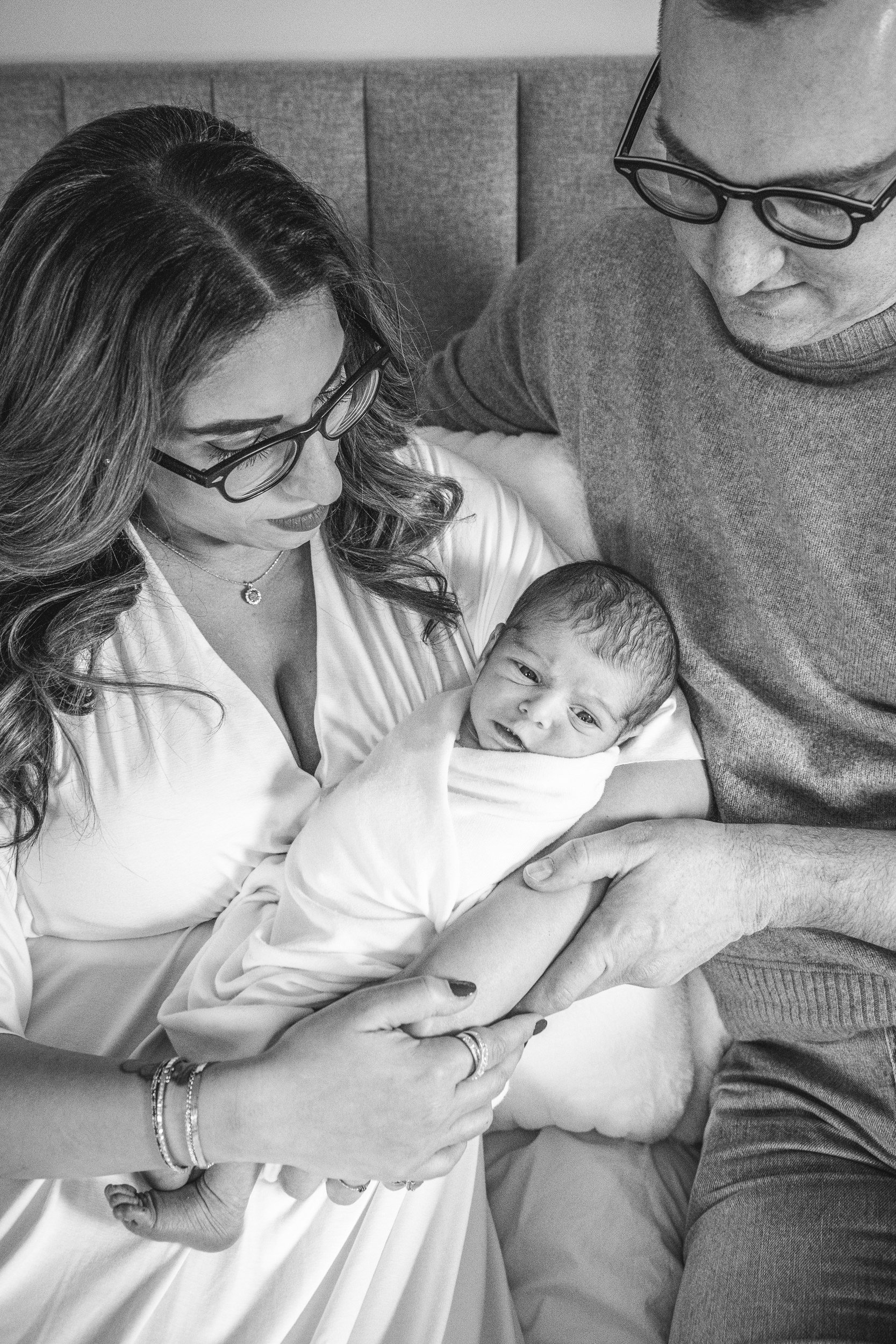  Family of three with a baby in the center captured by Nicole Hawkins Photography a professional family photographer. NJ family #NicoleHawkinsPhotography #NicoleHawkinsFamily #Newborns #InHomeNewborns #NicoleHawkinsNewborns #NJnewborns #babygirl 