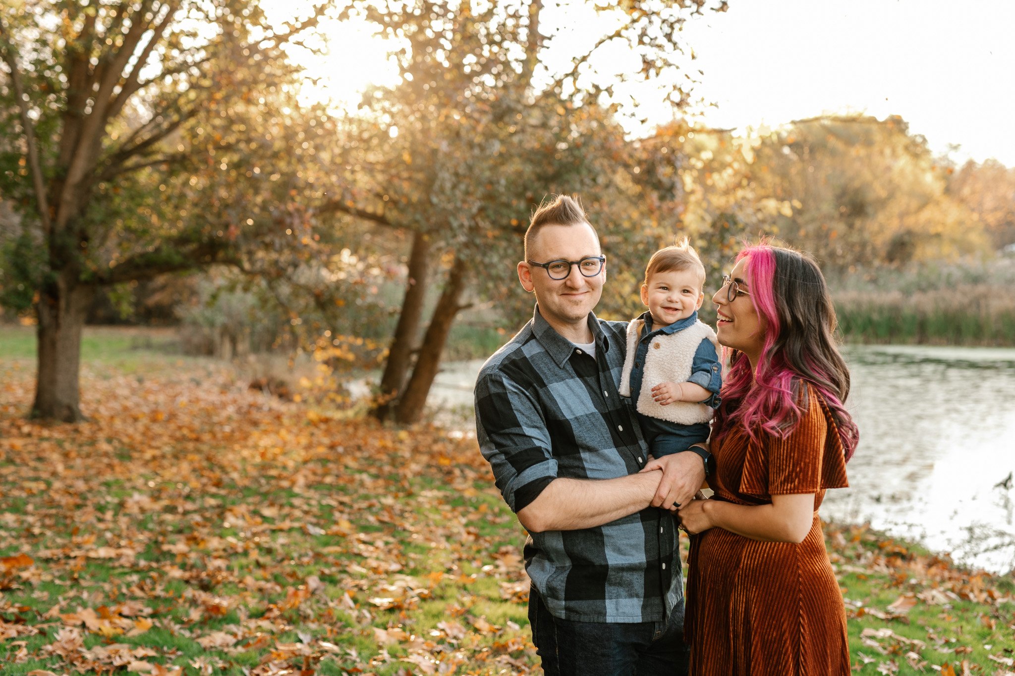  The family portrait was taken next to a river in the New Jersey fall time by Nicole Hawkins Photography. fall family style #NicoleHawkinsPhotography #NicoleHawkinsFamily #fallfamilyphotos #fallphotos #familyphotographerNJ #NJfallfamilypics 