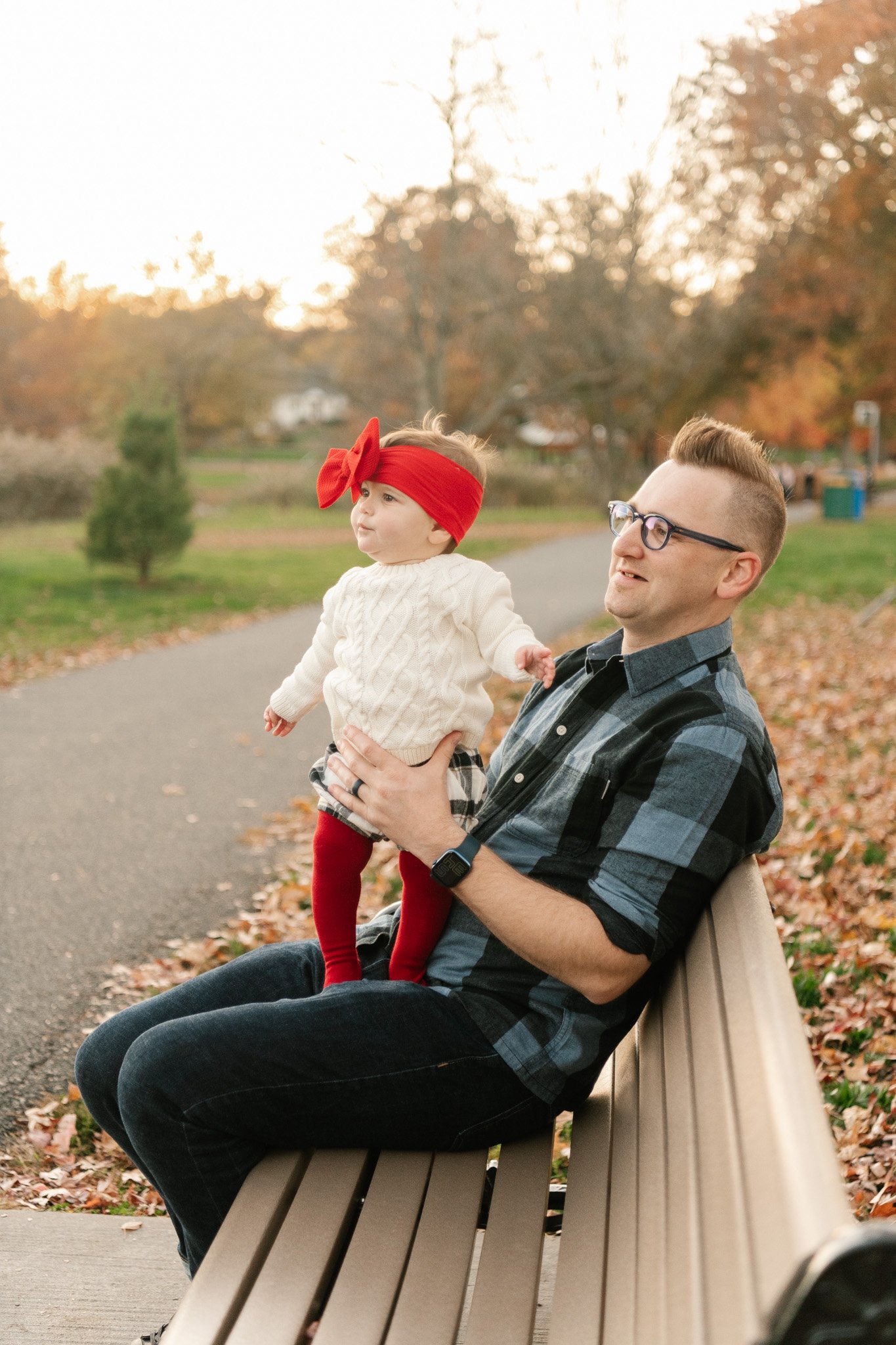  New Jersey family photographer Nicole Hawkins Photography captures a baby with her bow falling down on her eyes. candid family pic #NicoleHawkinsPhotography #NicoleHawkinsFamily #fallfamilyphotos #fallphotos #familyphotographerNJ #NJfallfamilypics 