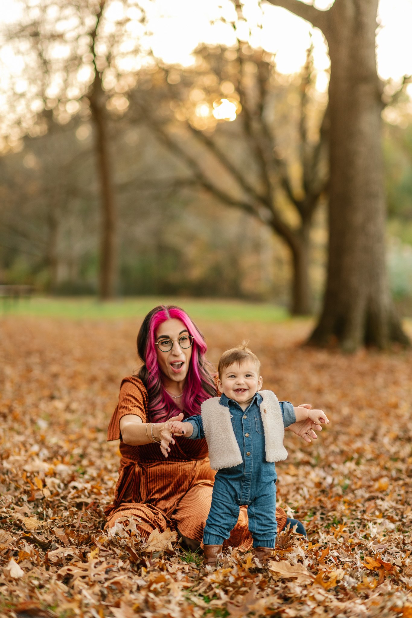  Nicole Hawkins Photography captures a mother watching her little girl trying to learn how to walk. walking pictures of baby #NicoleHawkinsPhotography #NicoleHawkinsFamily #fallfamilyphotos #fallphotos #familyphotographerNJ #NJfallfamilypics 