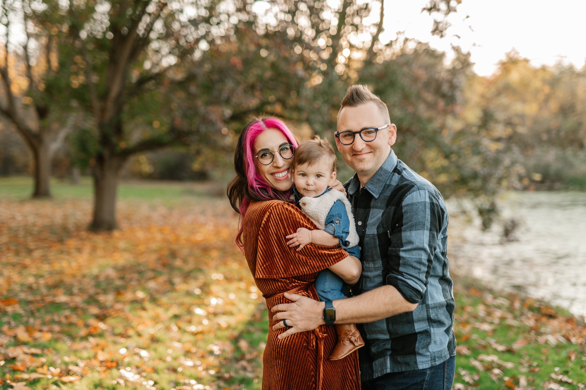  Family portrait with a mother, father, and baby in the New Jersey fall leaves by Nicole Hawkins Photography. family fall NJ NY #NicoleHawkinsPhotography #NicoleHawkinsFamily #fallfamilyphotos #fallphotos #familyphotographerNJ #NJfallfamilypics 