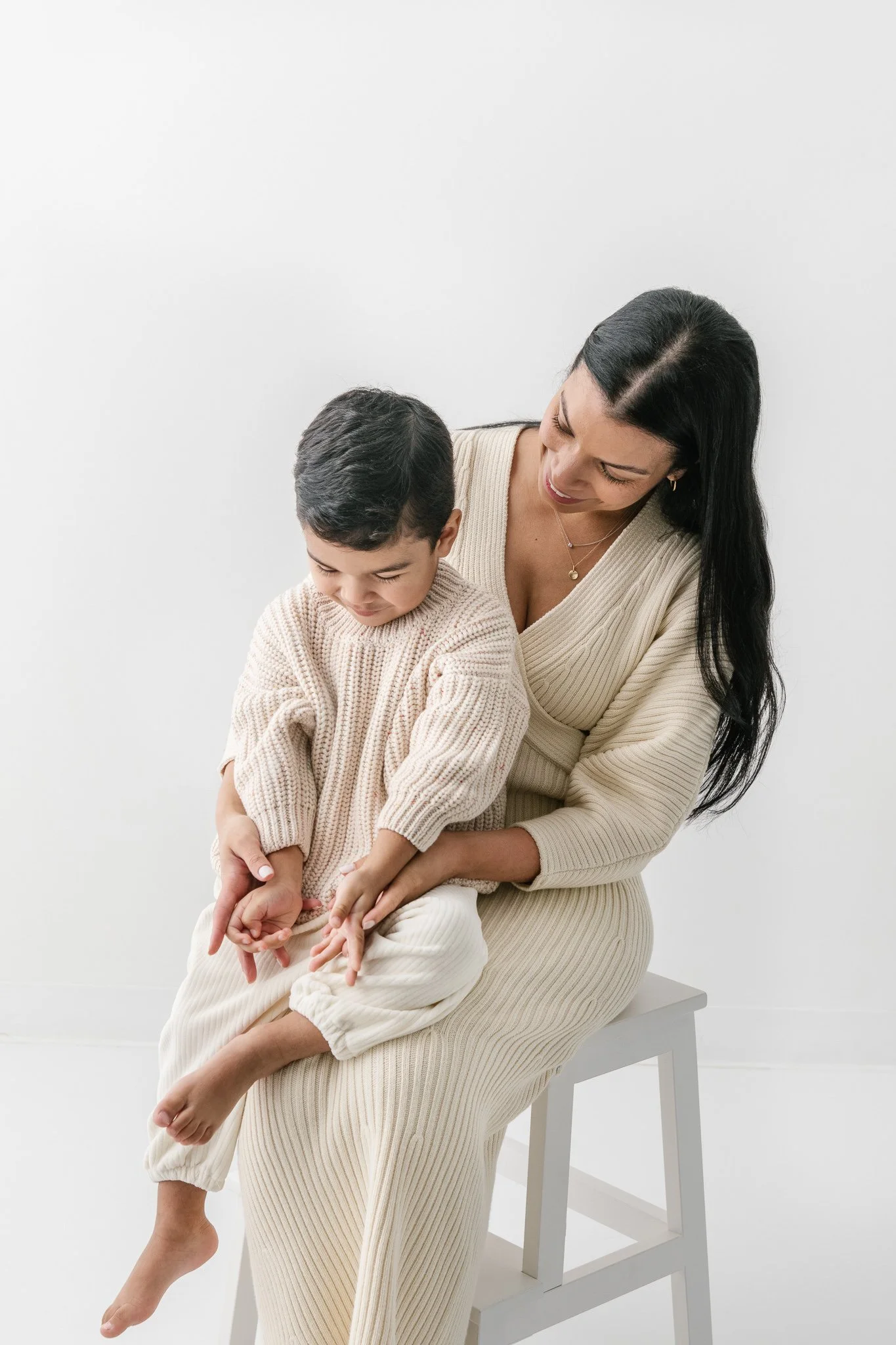  A mother and her son take a portrait in matching beige sweaters by Nicole Hawkins Photography. matching outfits #NicoleHawkinsPhotograaphy #NicoleHawkinsChildren #StudioBabies&amp;Children #NJphotographers #modernportraits #mom&amp;meportraits  