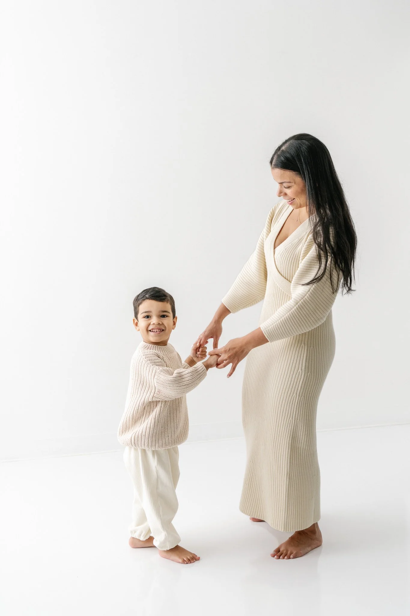 A mother and child dance in an all-white studio during portraits with Nicole Hawkins Photography. dancing boy and mom #NicoleHawkinsPhotograaphy #NicoleHawkinsChildren #StudioBabies&amp;Children #NJphotographers #modernportraits #mom&amp;meportraits