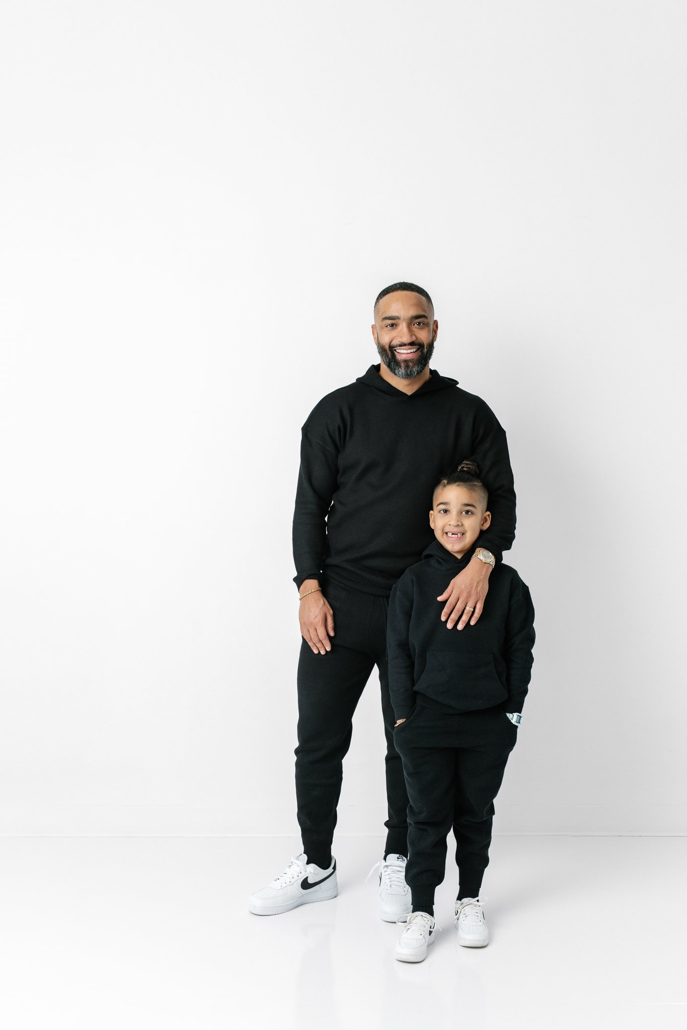  Modern studio portrait of a father and his son in matching outfits by Nicole Hawkins Photography. modern style #NicoleHawkinsPhotograaphy #NicoleHawkinsFamilies #Modernfamilypictures #studioportraits #matchingfamilyoutfits #NJphotographer 