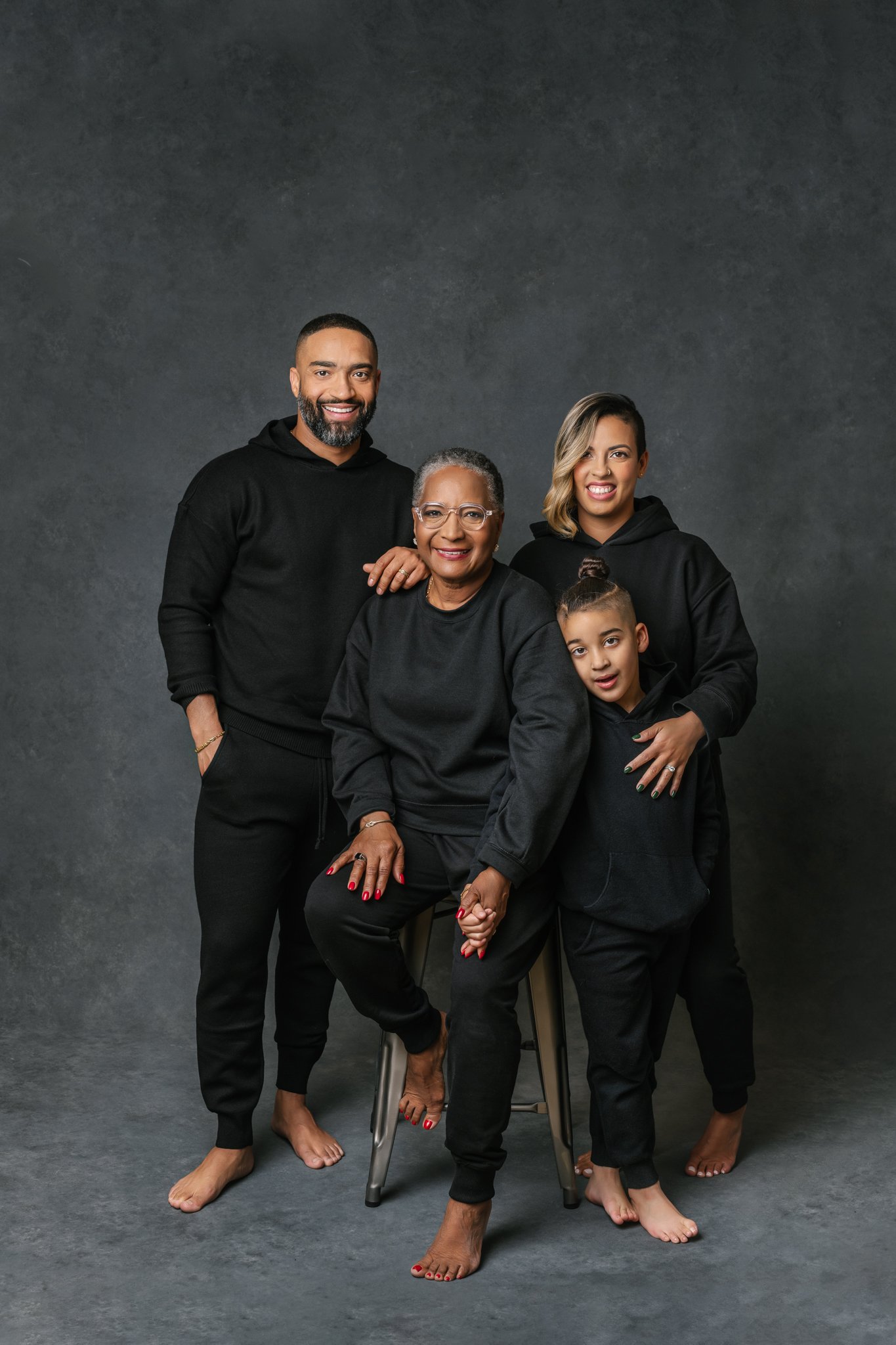  Nicole Hawkins Photography captures a portrait of a family of three and their grandma. extended family pictures #NicoleHawkinsPhotograaphy #NicoleHawkinsFamilies #Modernfamilypictures #studioportraits #matchingfamilyoutfits #NJphotographer 
