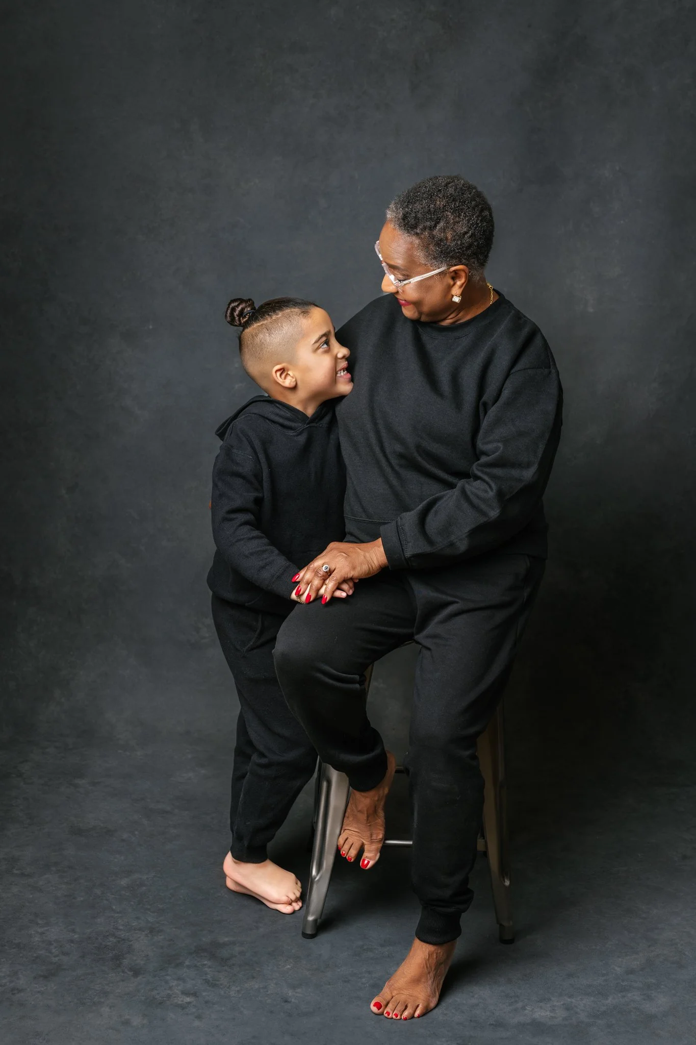  Nicole Hawkins's PHotography captures a grandmother hugging her grandson during modern studio portraits. grandma #NicoleHawkinsPhotograaphy #NicoleHawkinsFamilies #Modernfamilypictures #studioportraits #matchingfamilyoutfits #NJphotographer 
