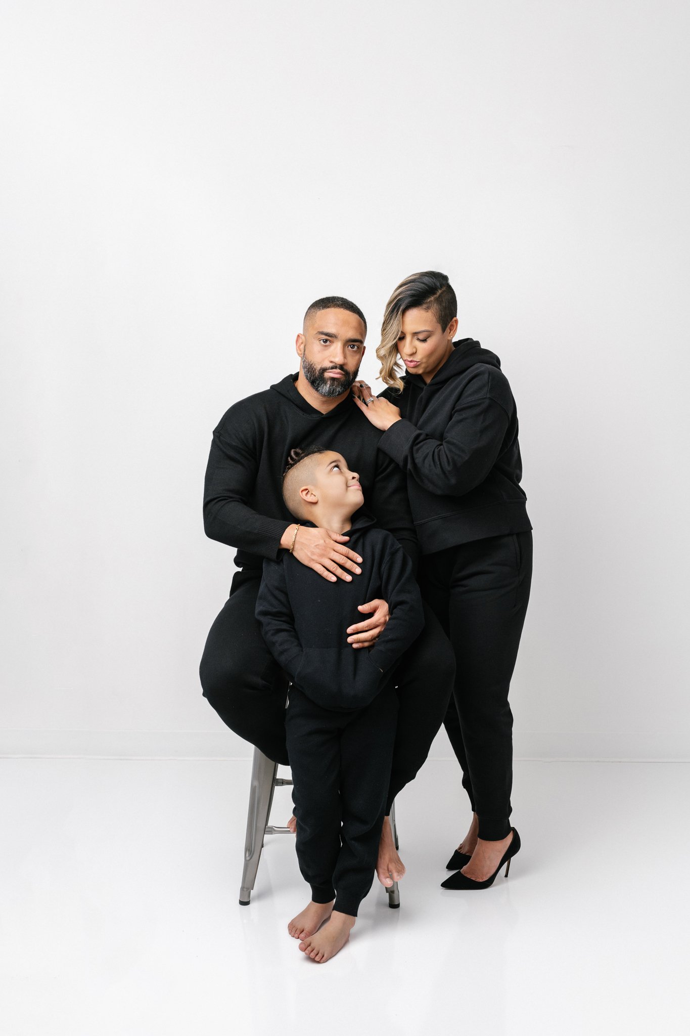  Candid studio portrait with a white background and black attire by Nicole Hawkins Photography. candid photos #NicoleHawkinsPhotograaphy #NicoleHawkinsFamilies #Modernfamilypictures #studioportraits #matchingfamilyoutfits #NJphotographer 