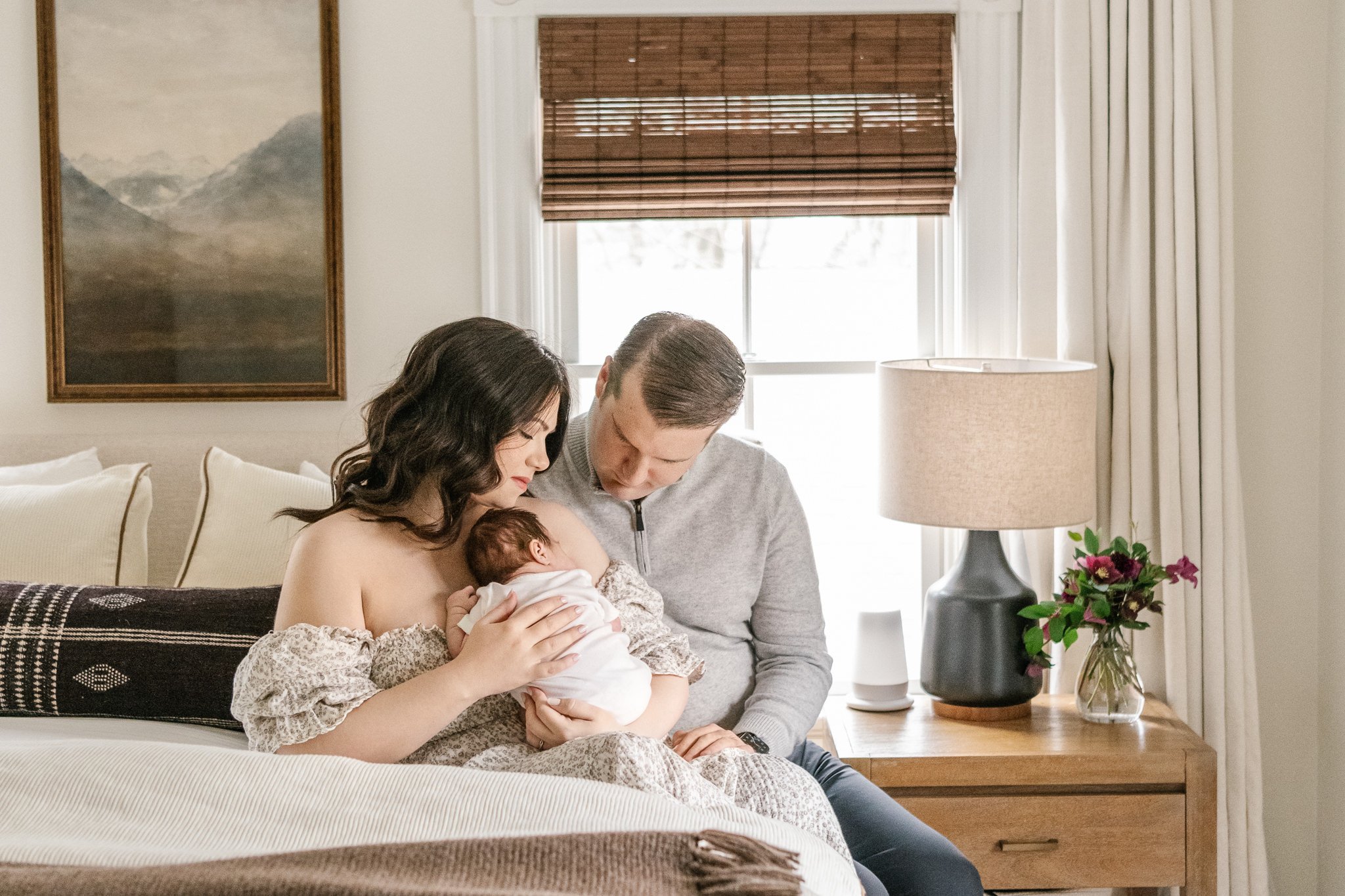  A timeless portrait of a new family of three sitting on their bed in New Jersey by Nicole Hawkins Photography. romantic timeless family portraits #NicoleHawkinsPhotography #NicoleHawkinsNewborns #MontclairNewbornPhotographer #InHomeNewborns #NJNewbo