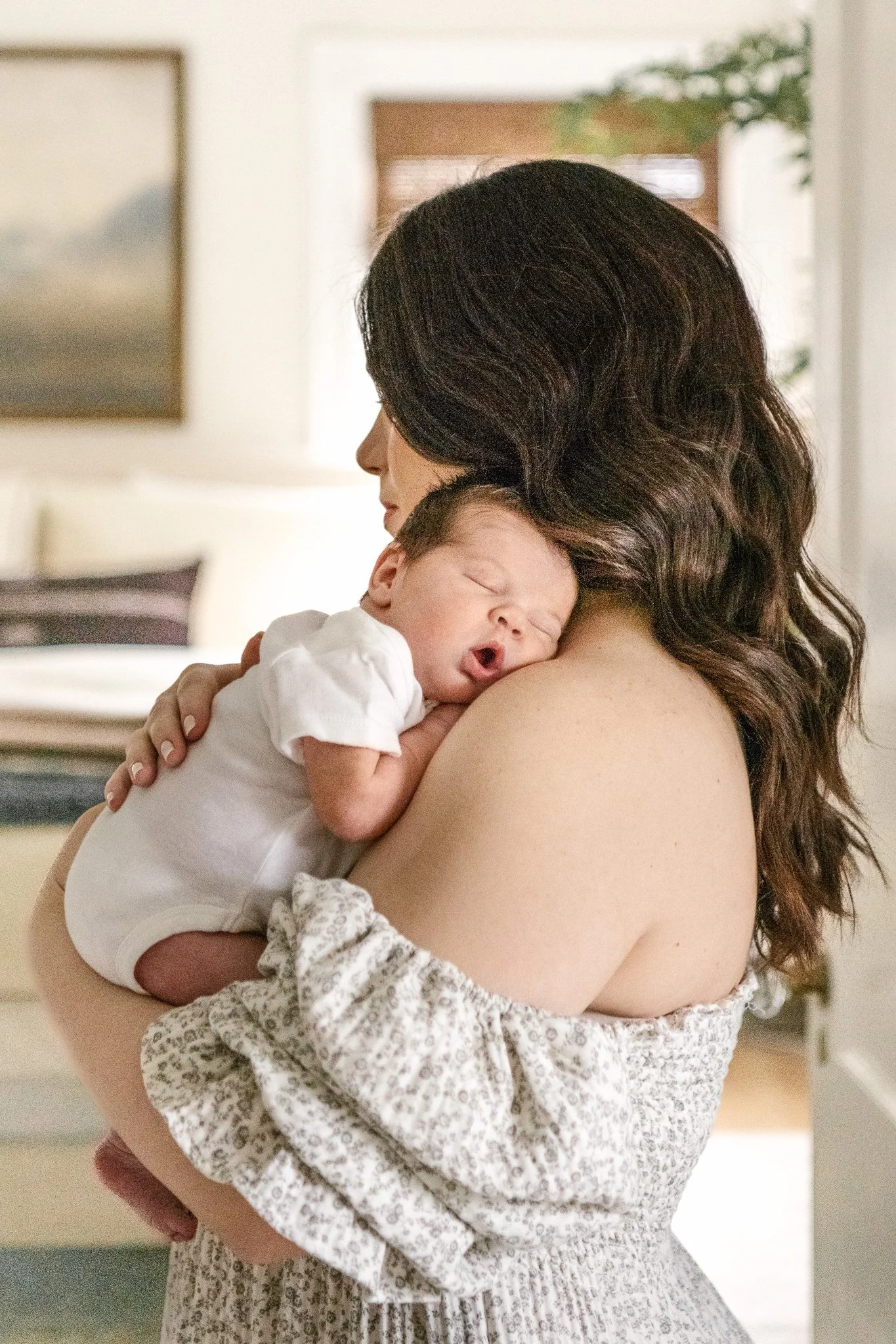  A mother rests her baby on her shoulder during a newborn in-home session with Nicole Hawkins Photography. off the shoulder dress mothers #NicoleHawkinsPhotography #NicoleHawkinsNewborns #MontclairNewbornPhotographer #InHomeNewborns #NJNewborns #Baby