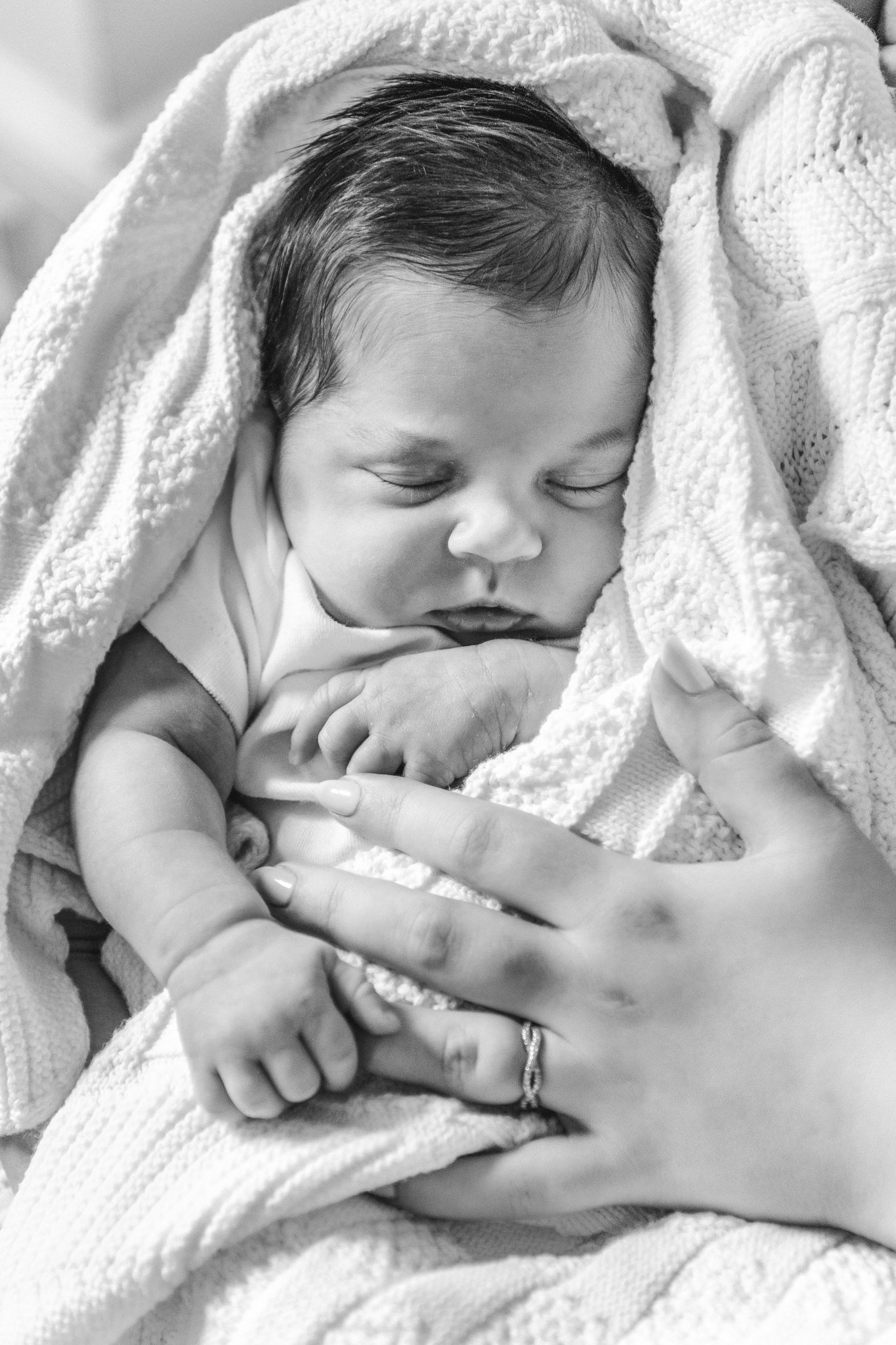  Precious portrait of a newborn baby girl sleeping swaddled up captured by Nicole Hawkins Photography. NJ newborn photography professional #NicoleHawkinsPhotography #NicoleHawkinsNewborns #MontclairNewbornPhotographer #InHomeNewborns #NJNewborns #Bab