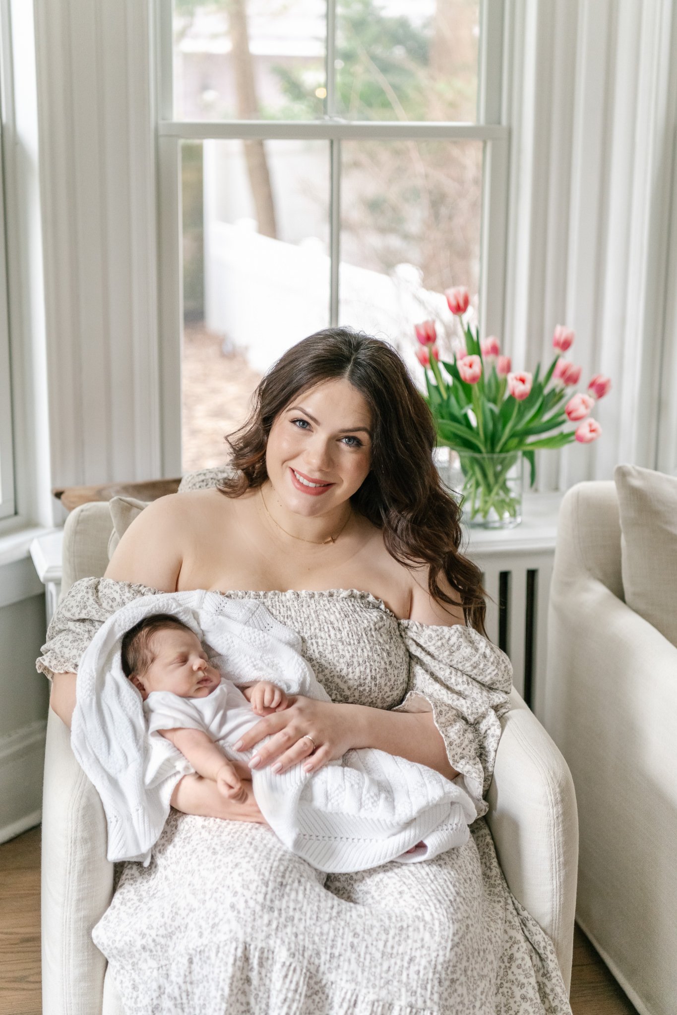  A mother smiles while sitting in her home during a newborn session with Professional Nicole Hawkins Photography. mother and baby portrait in-home newborn outfit ideas #NicoleHawkinsPhotography #NicoleHawkinsNewborns #MontclairNewbornPhotographer #In